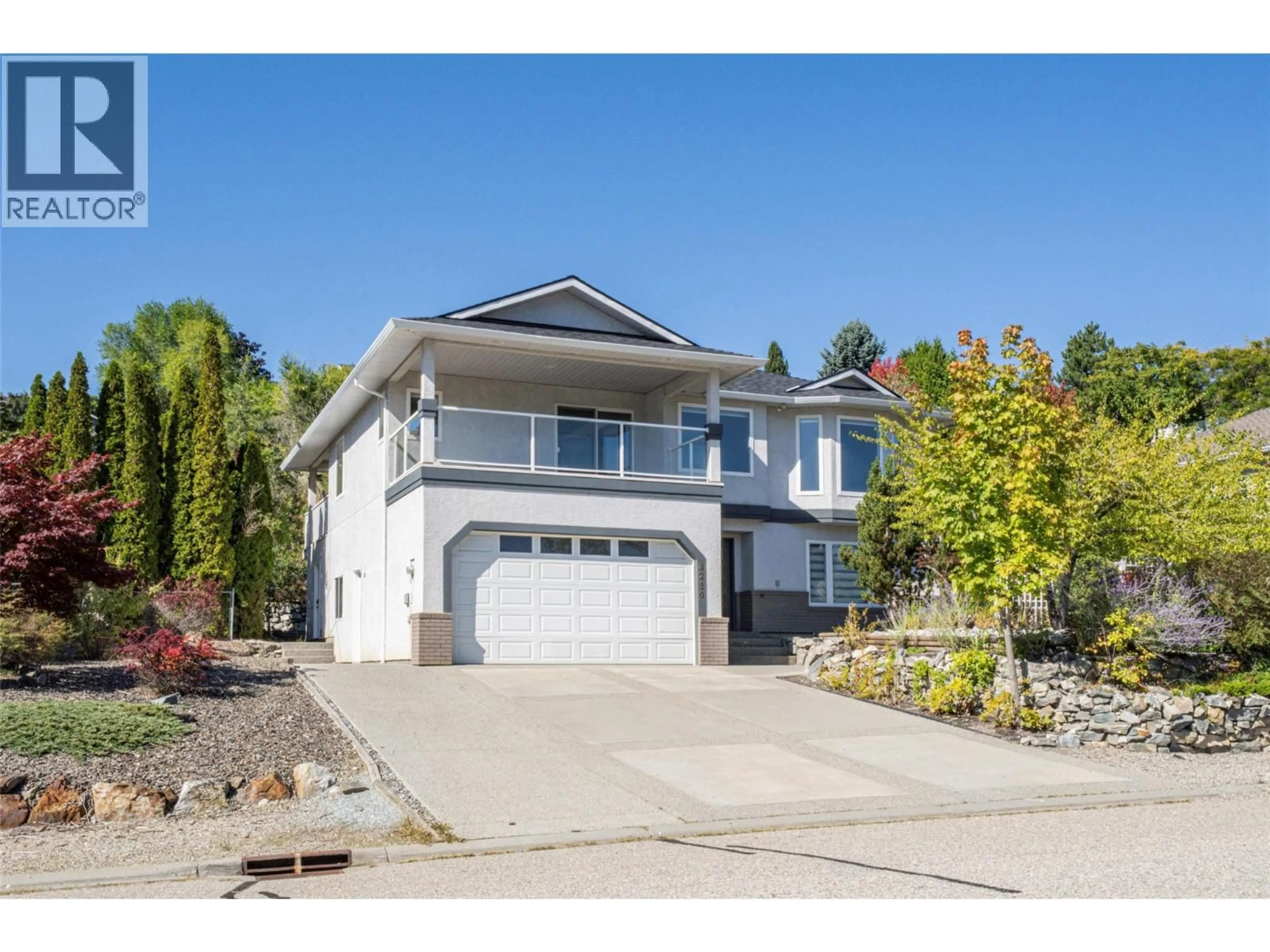 Home with vinyl exterior material, street for 8210 STONERIDGE DRIVE, Coldstream British Columbia V1B3M3