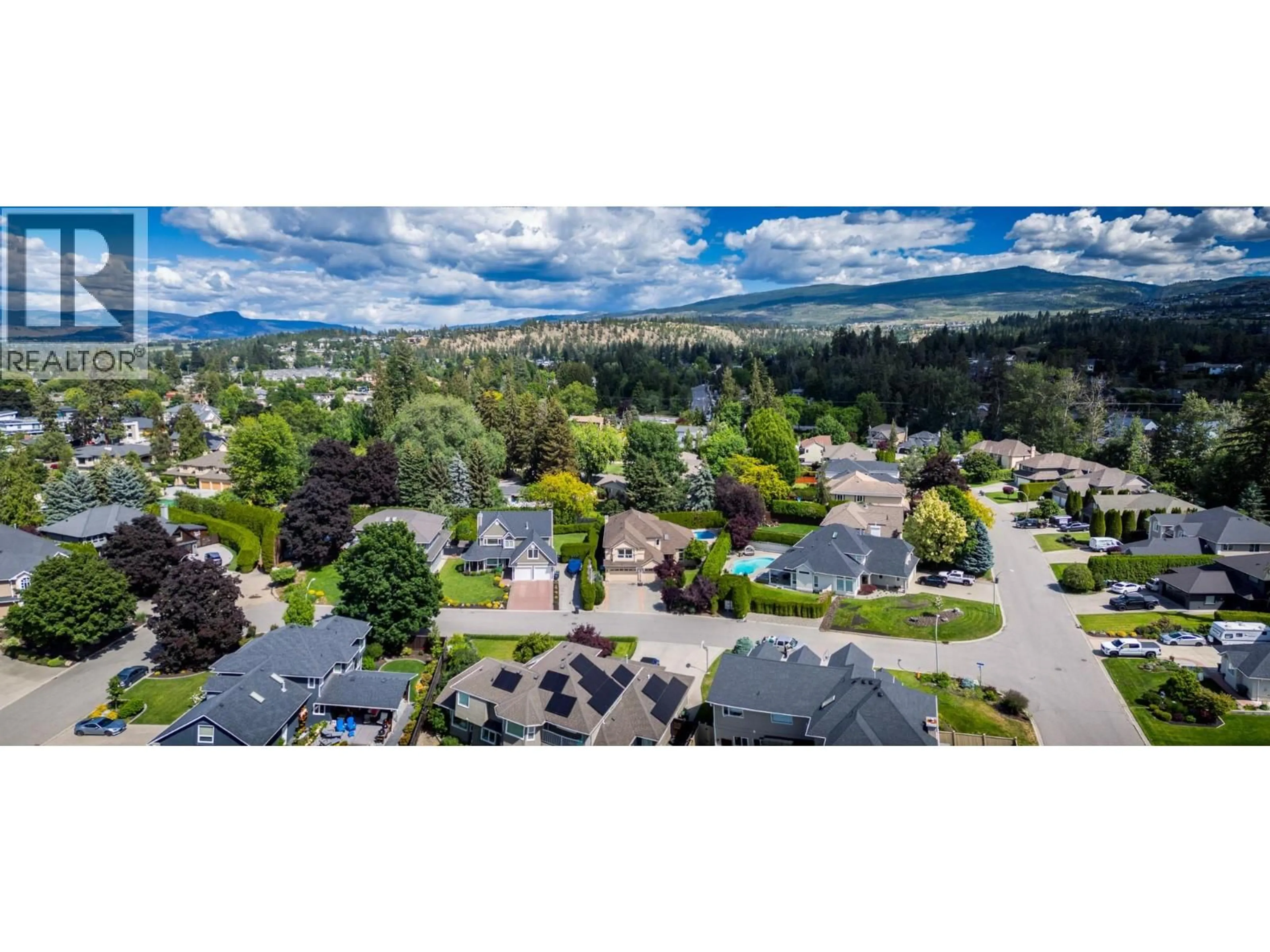 A pic from outside/outdoor area/front of a property/back of a property/a pic from drone, mountain view for 492 CARONA CRESCENT, Kelowna British Columbia V1W3C6