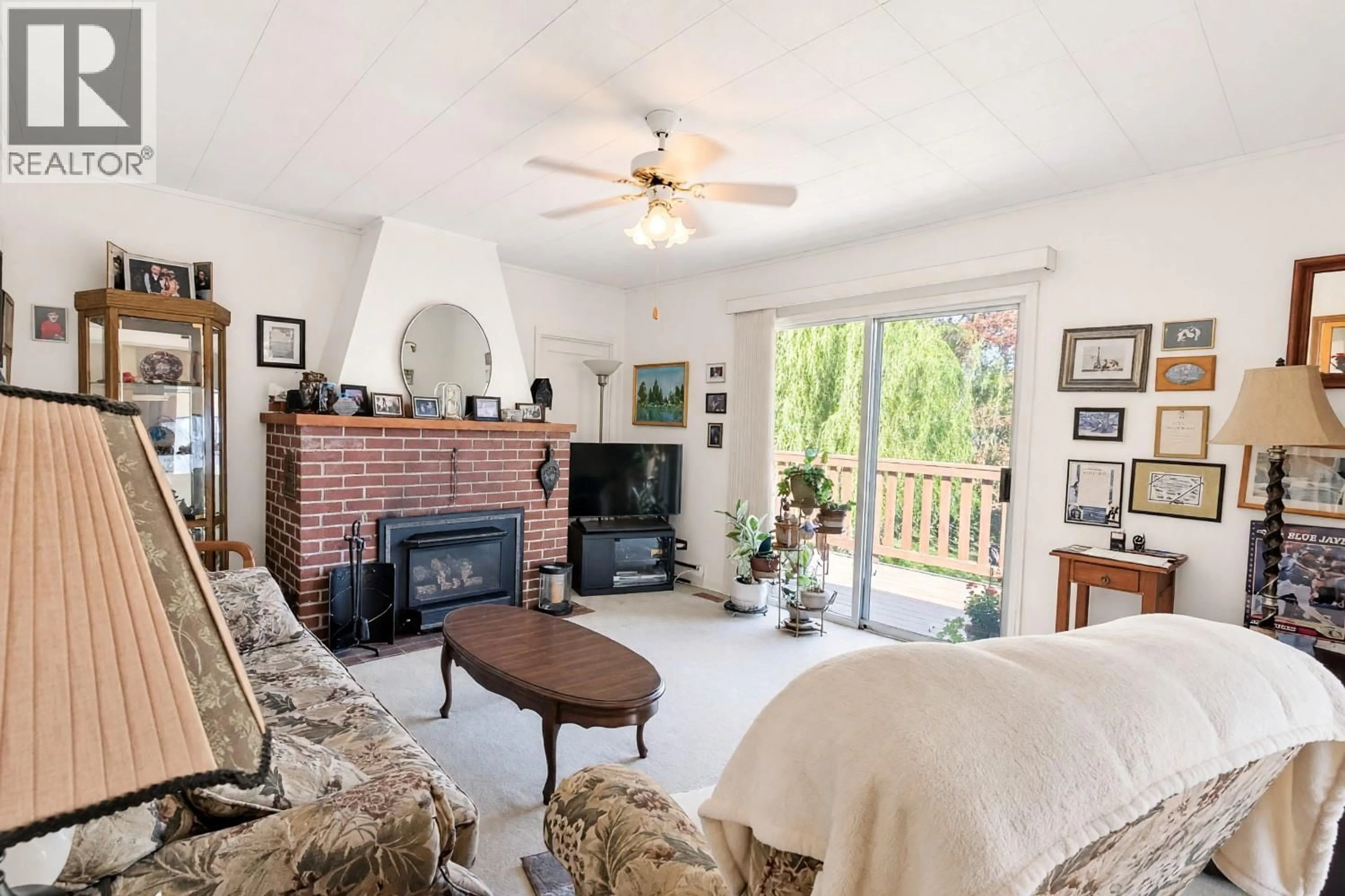Living room with furniture, ceramic/tile floor for 15610 FOSBERY ROAD, Summerland British Columbia V0H1Z6