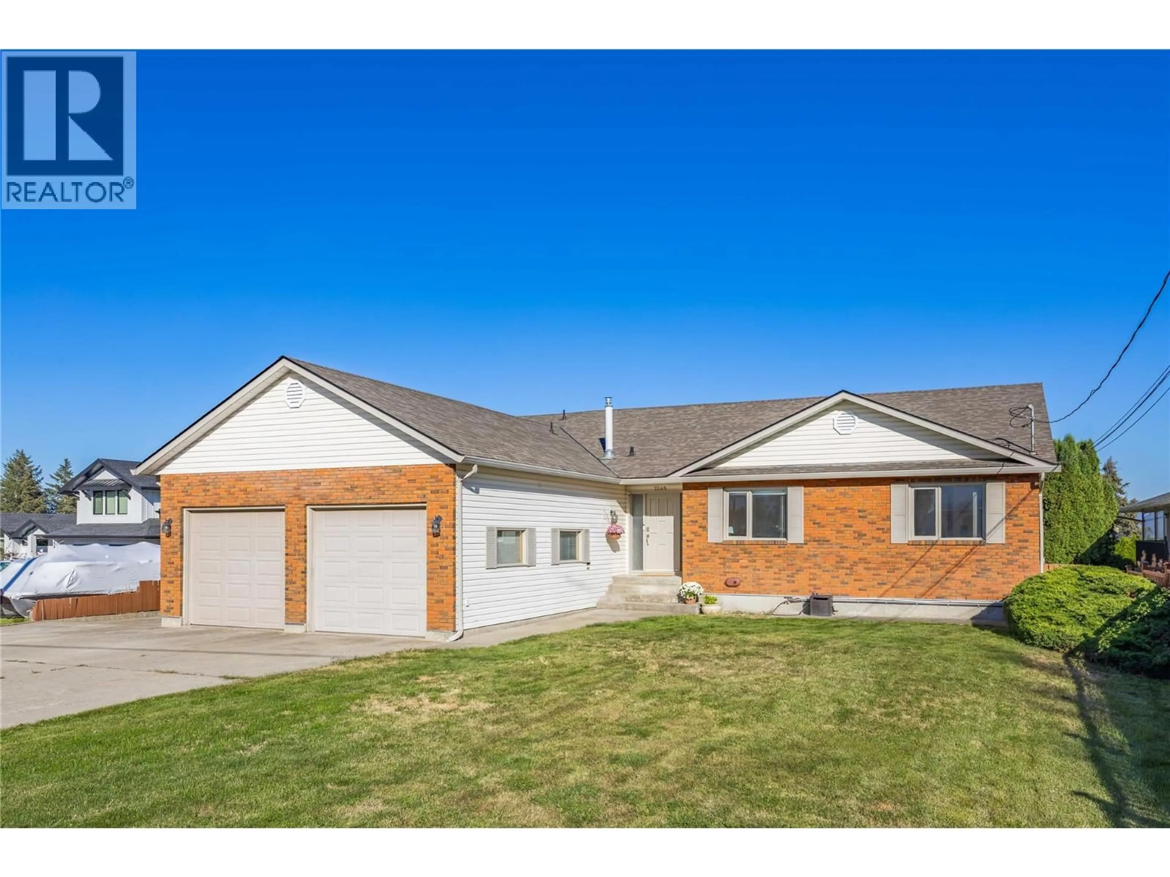 Home with brick exterior material, street for 2245 THACKER DRIVE, West Kelowna British Columbia V1Z1V5