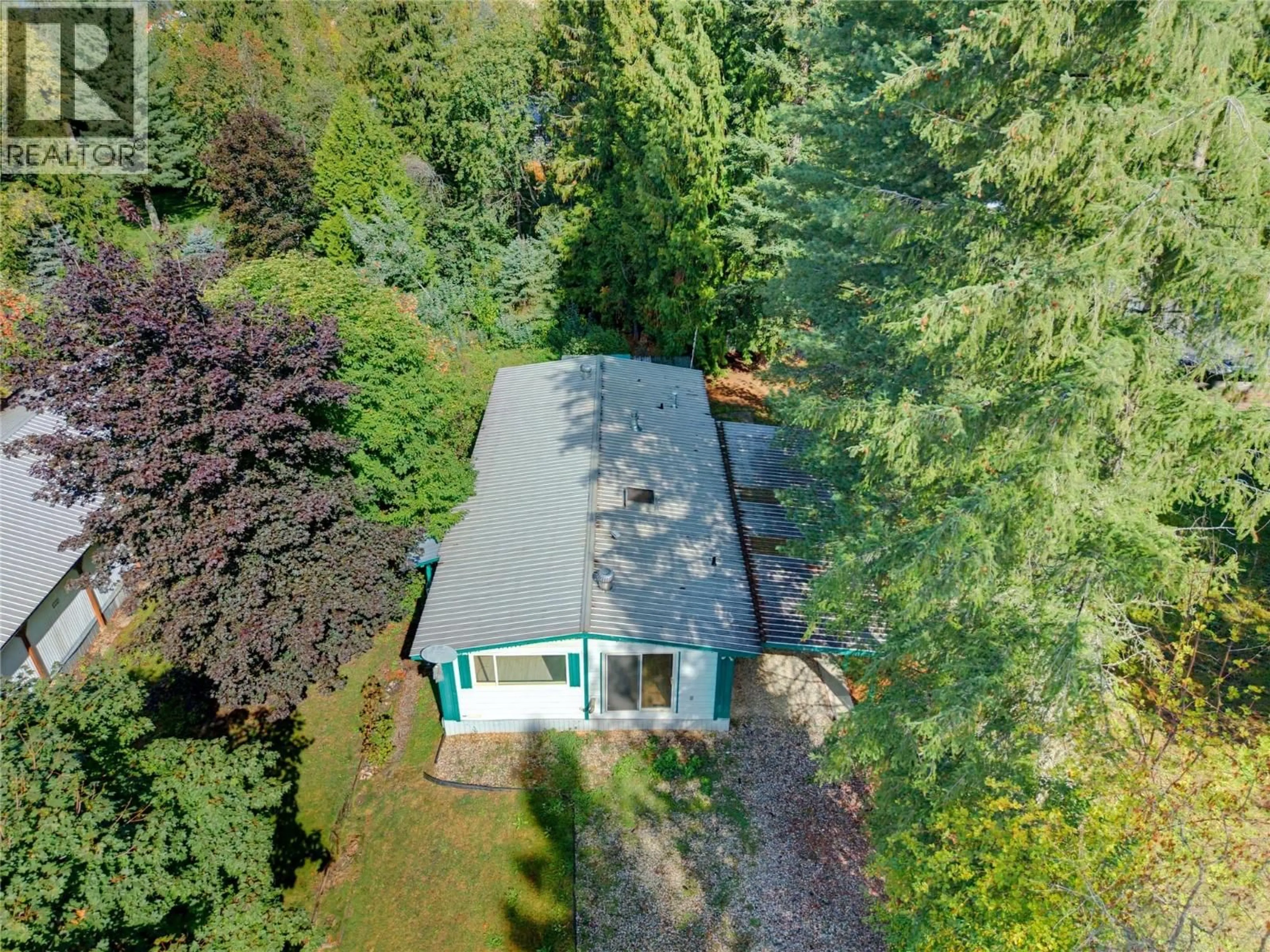A pic from outside/outdoor area/front of a property/back of a property/a pic from drone, forest/trees view for 8 - 5 97A HIGHWAY, Sicamous British Columbia V0E2V1