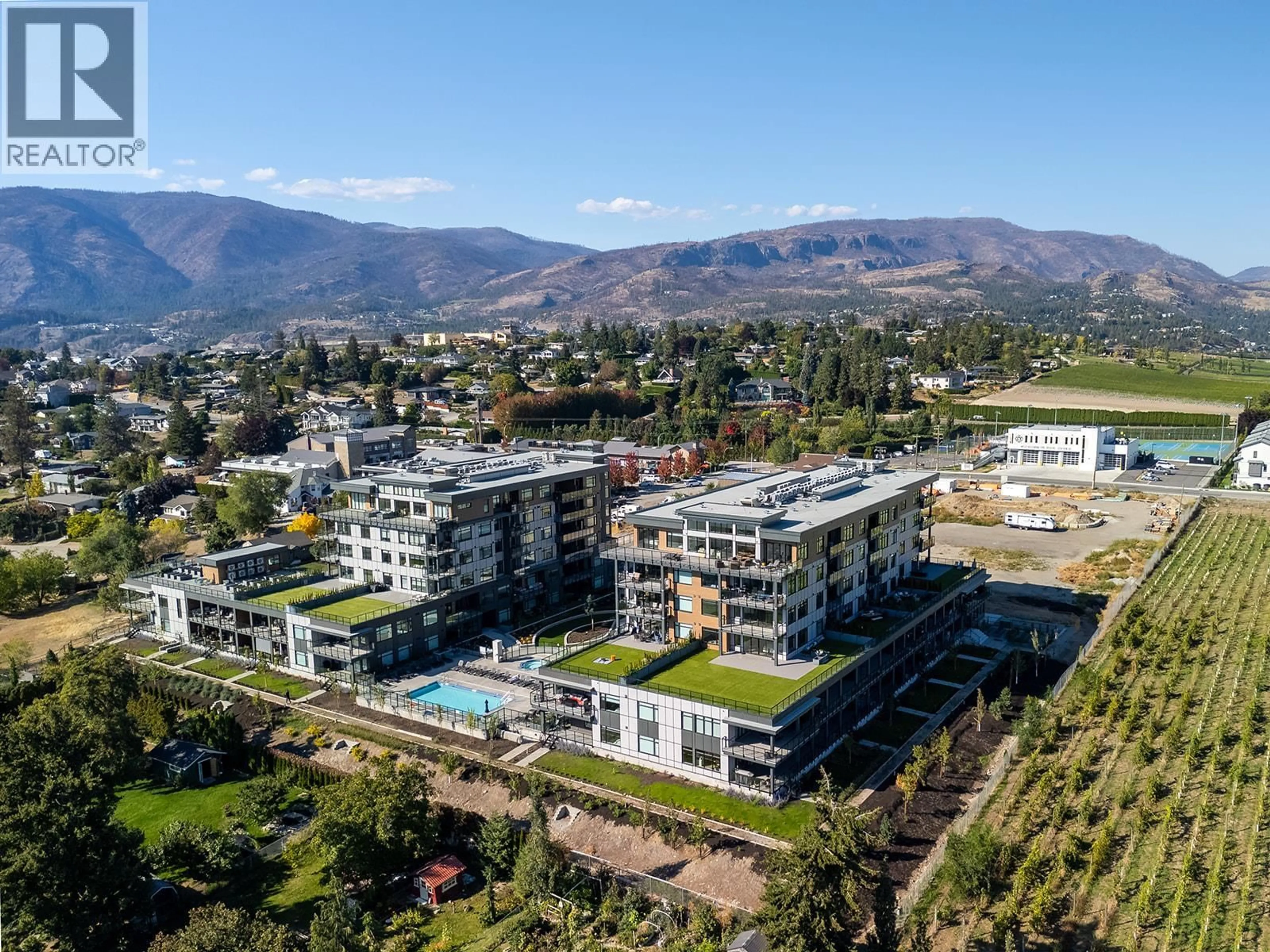 A pic from outside/outdoor area/front of a property/back of a property/a pic from drone, mountain view for 203 - 2780 OLALLA ROAD, West Kelowna British Columbia V1Z2A9