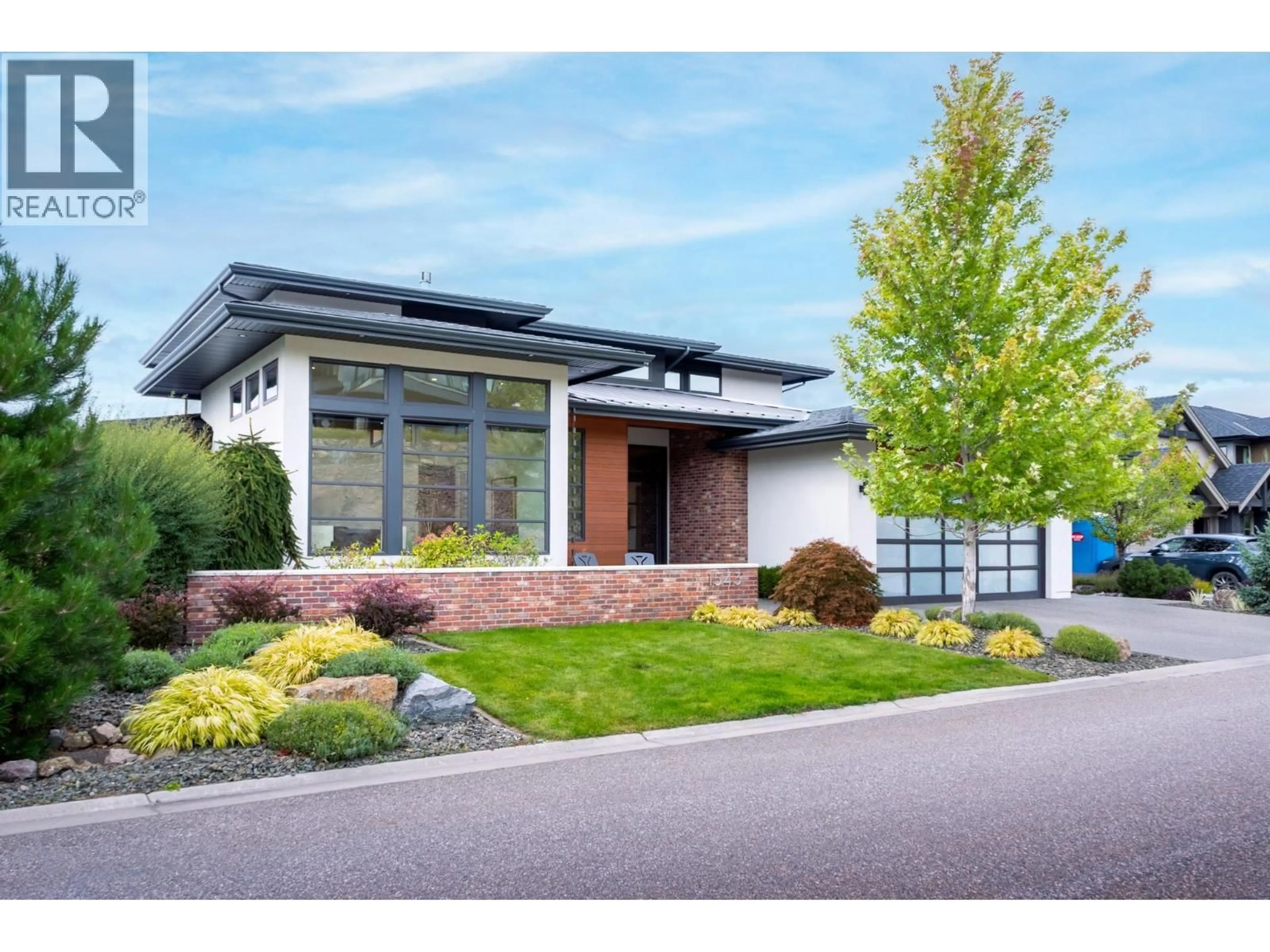 Home with brick exterior material, street for 1543 ROCKY POINT DRIVE, Kelowna British Columbia V1V3E2