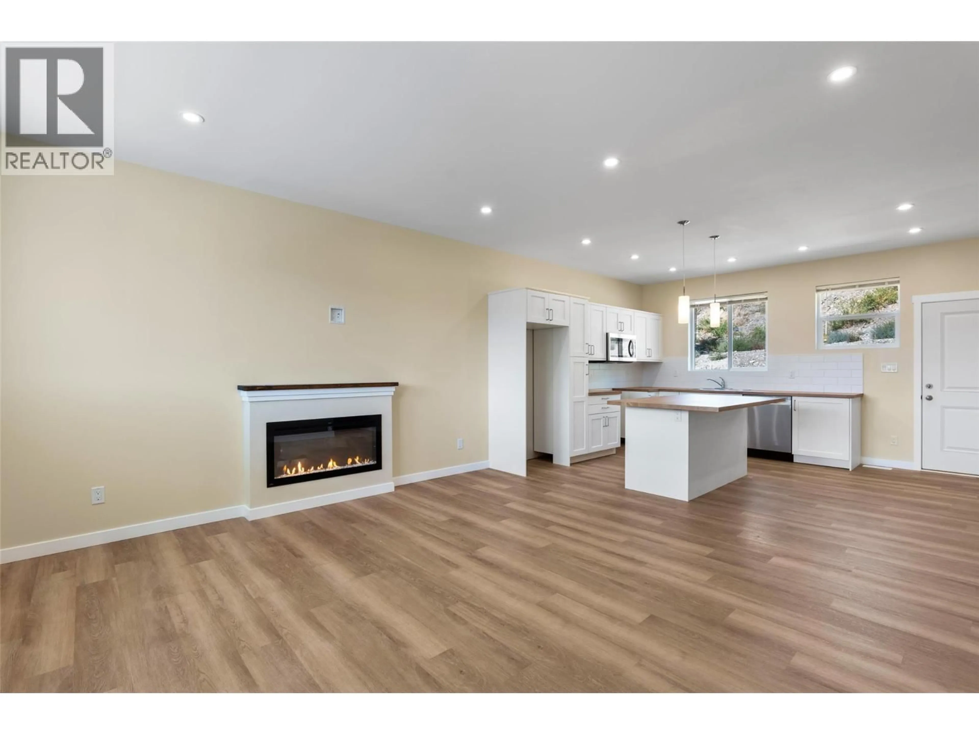 Open concept kitchen, wood/laminate floor for 2733 GRANDVIEW HEIGHTS, Merritt British Columbia V1K0A5