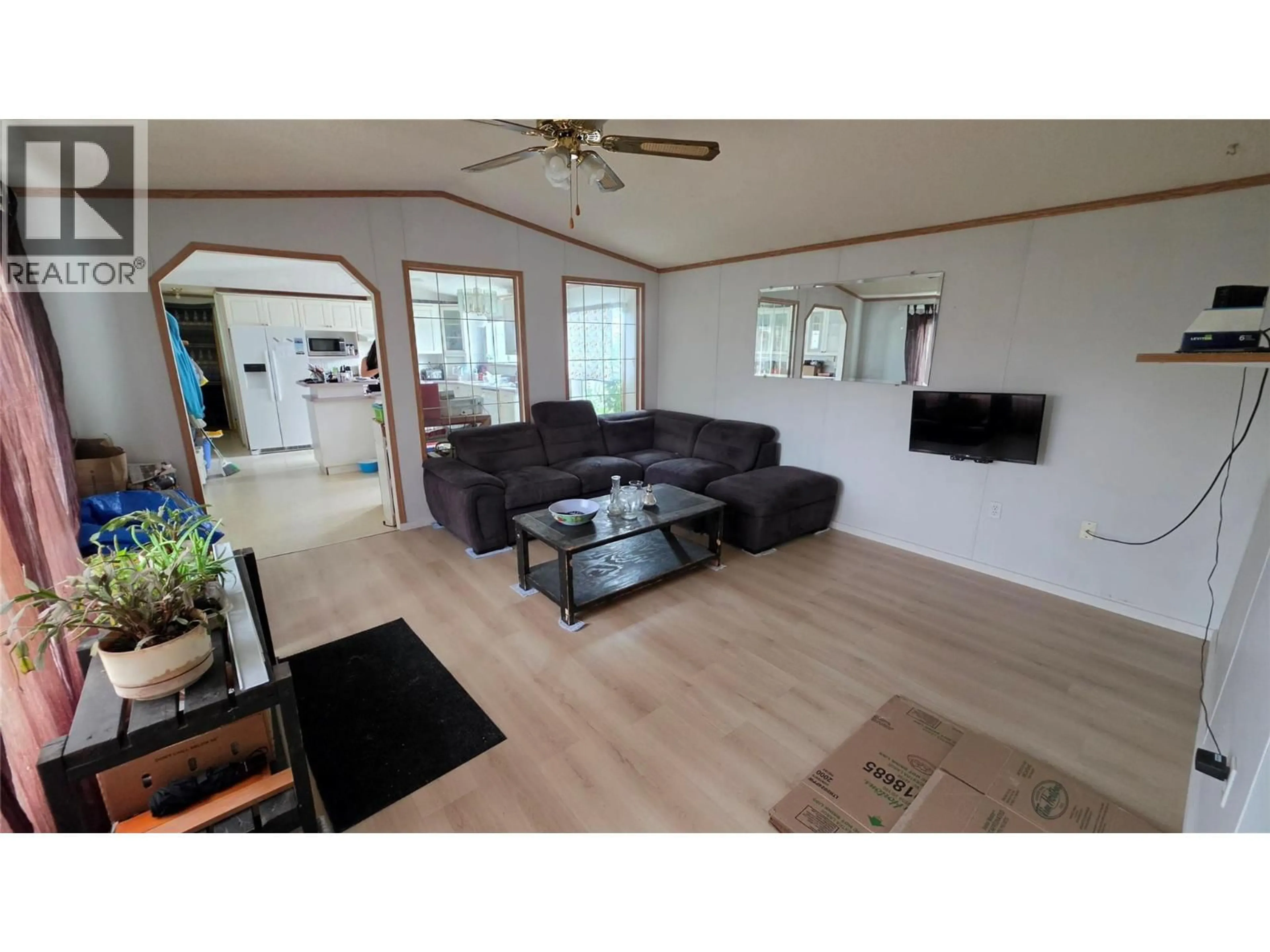 Living room with furniture, wood/laminate floor for 1201 118 AVENUE, Dawson Creek British Columbia V1G4L2