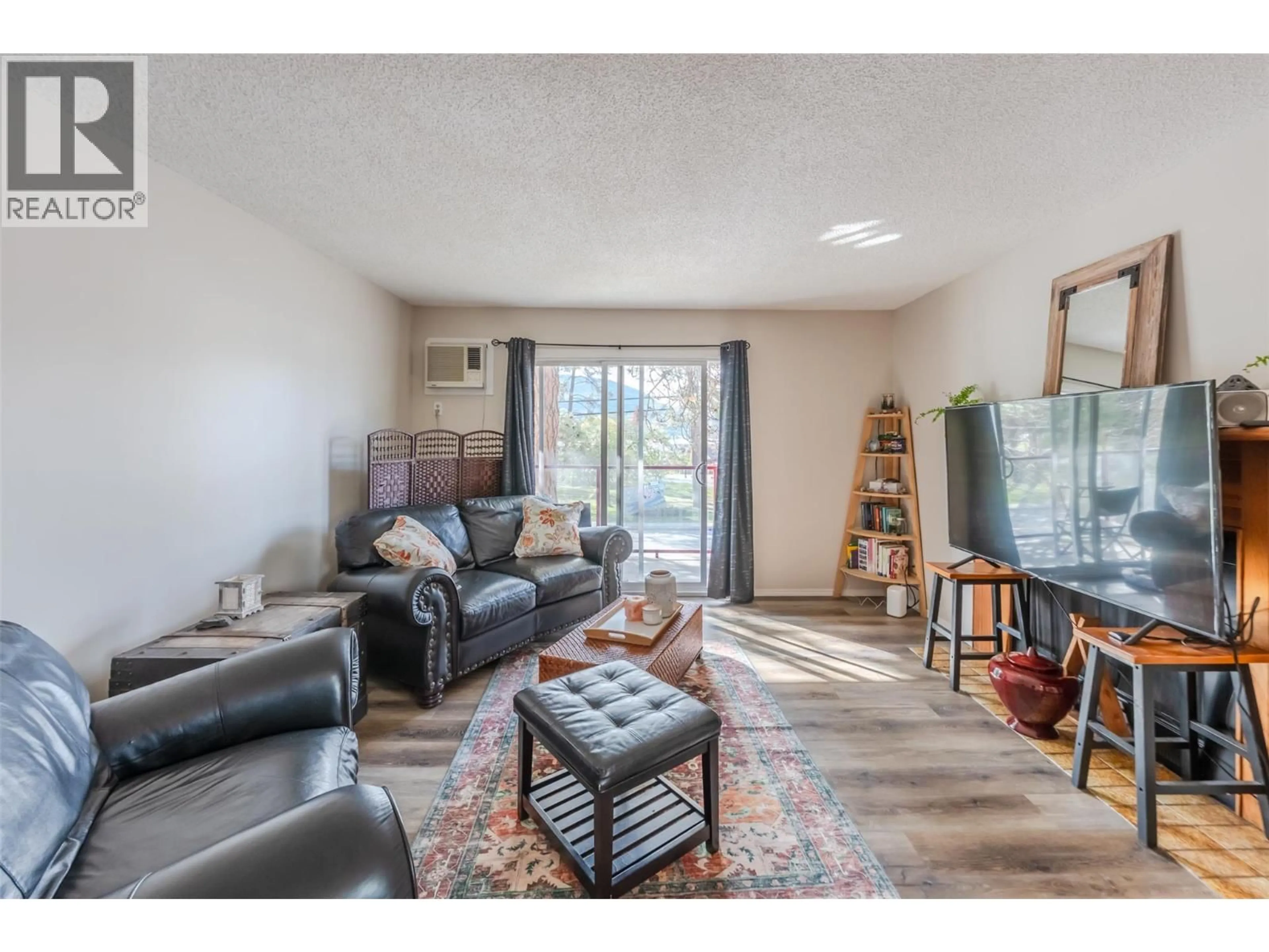 Living room with furniture, unknown for 303 - 110 SKAHA PLACE, Penticton British Columbia V2A7L1