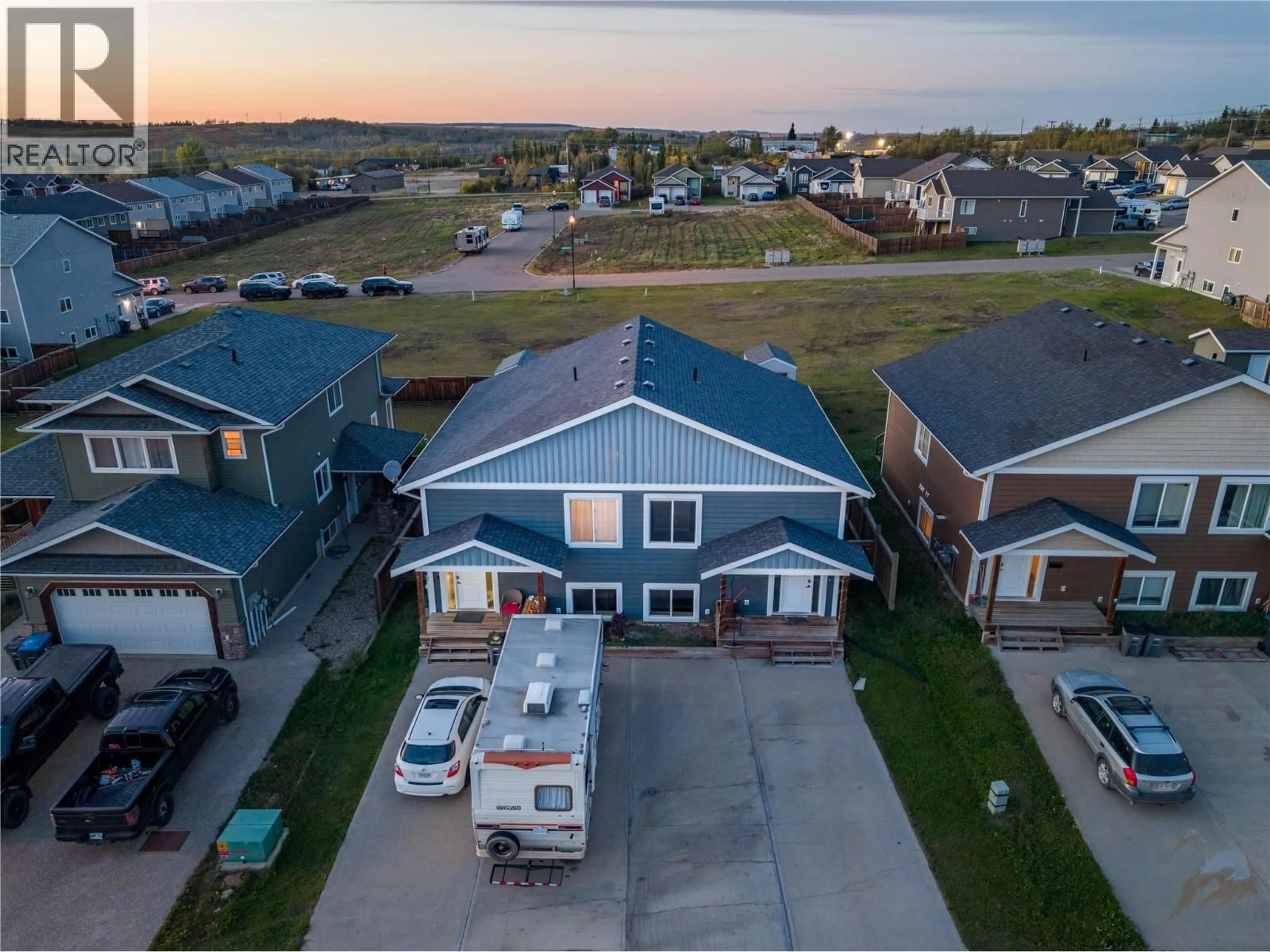 A pic from outside/outdoor area/front of a property/back of a property/a pic from drone, street for 1712/1714 84 AVENUE, Dawson Creek British Columbia V1G0E1