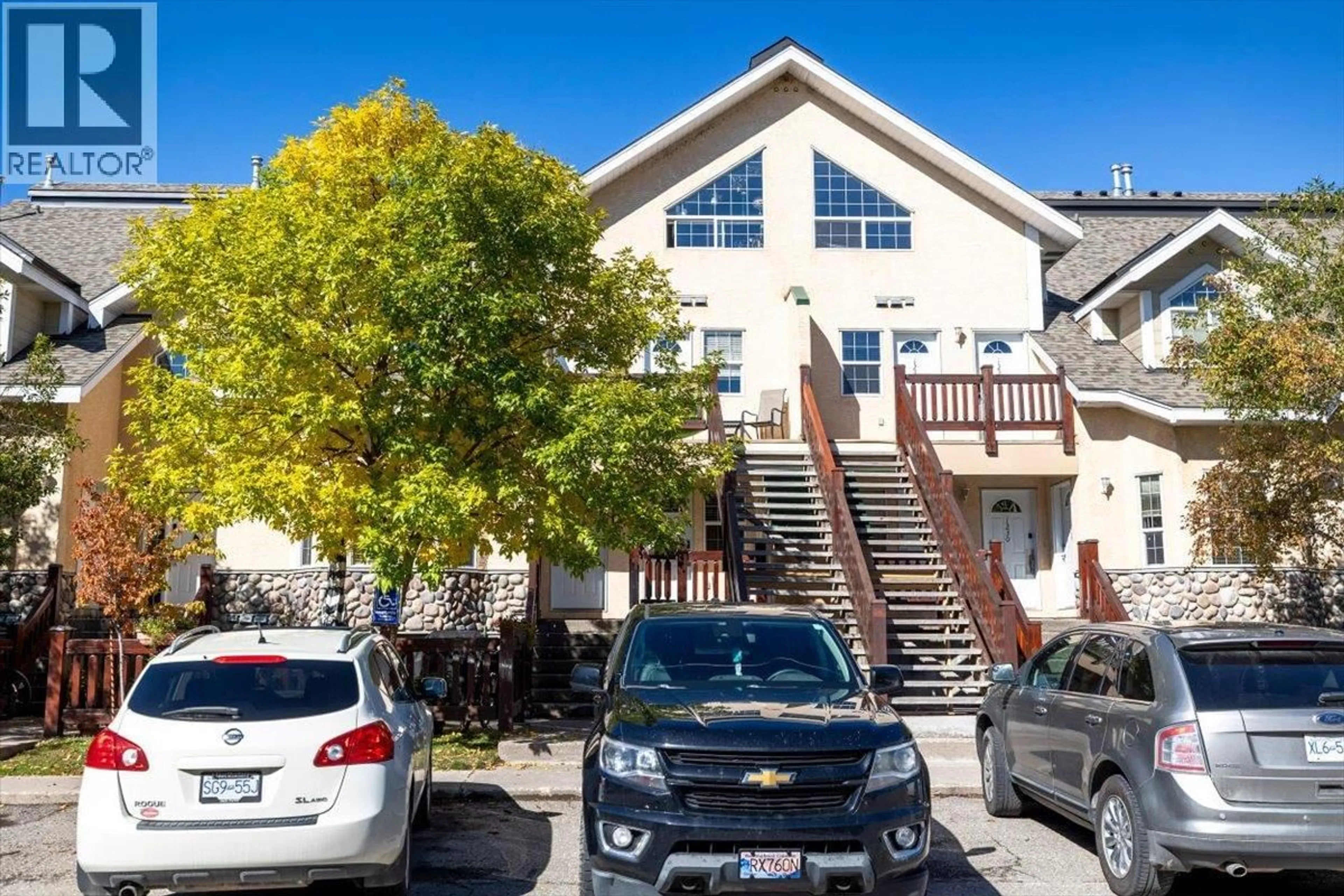 A pic from outside/outdoor area/front of a property/back of a property/a pic from drone, street for 1229 - 1200 RIVERSIDE WAY, Fernie British Columbia V0B1M7