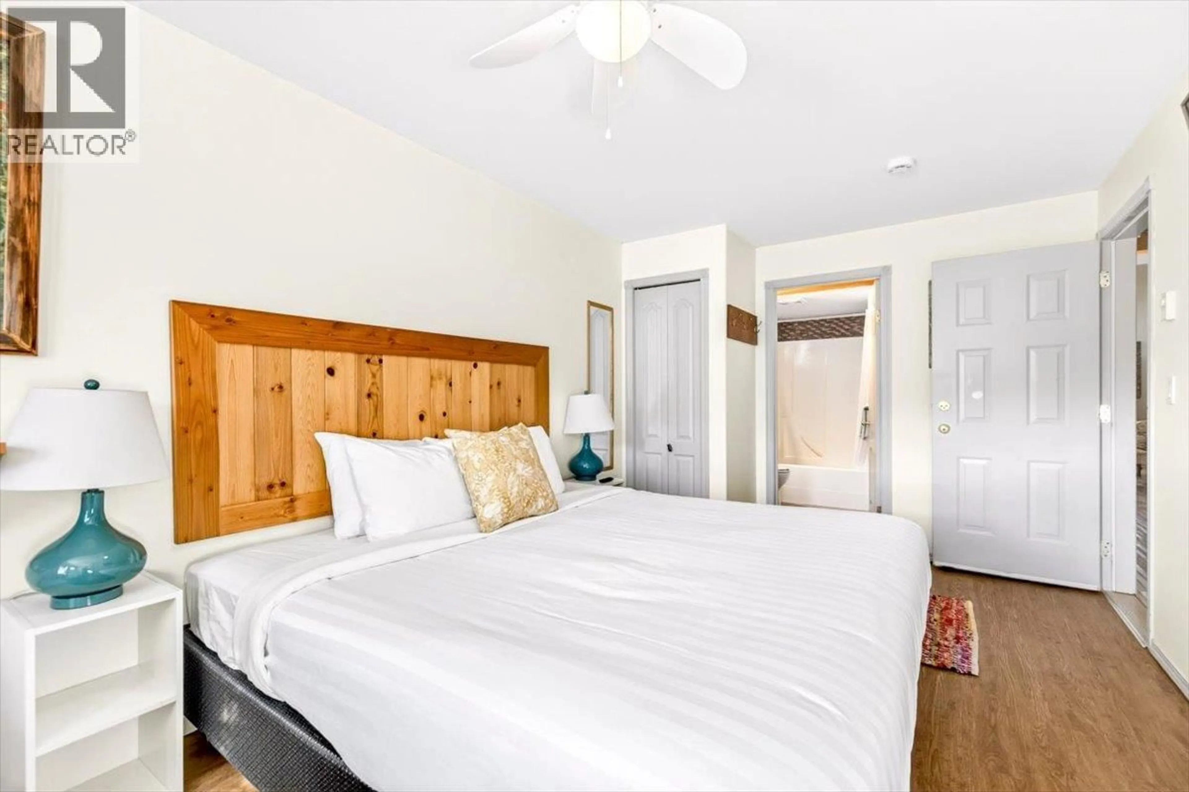 Bedroom with bed, wood/laminate floor for 1229 - 1200 RIVERSIDE WAY, Fernie British Columbia V0B1M7