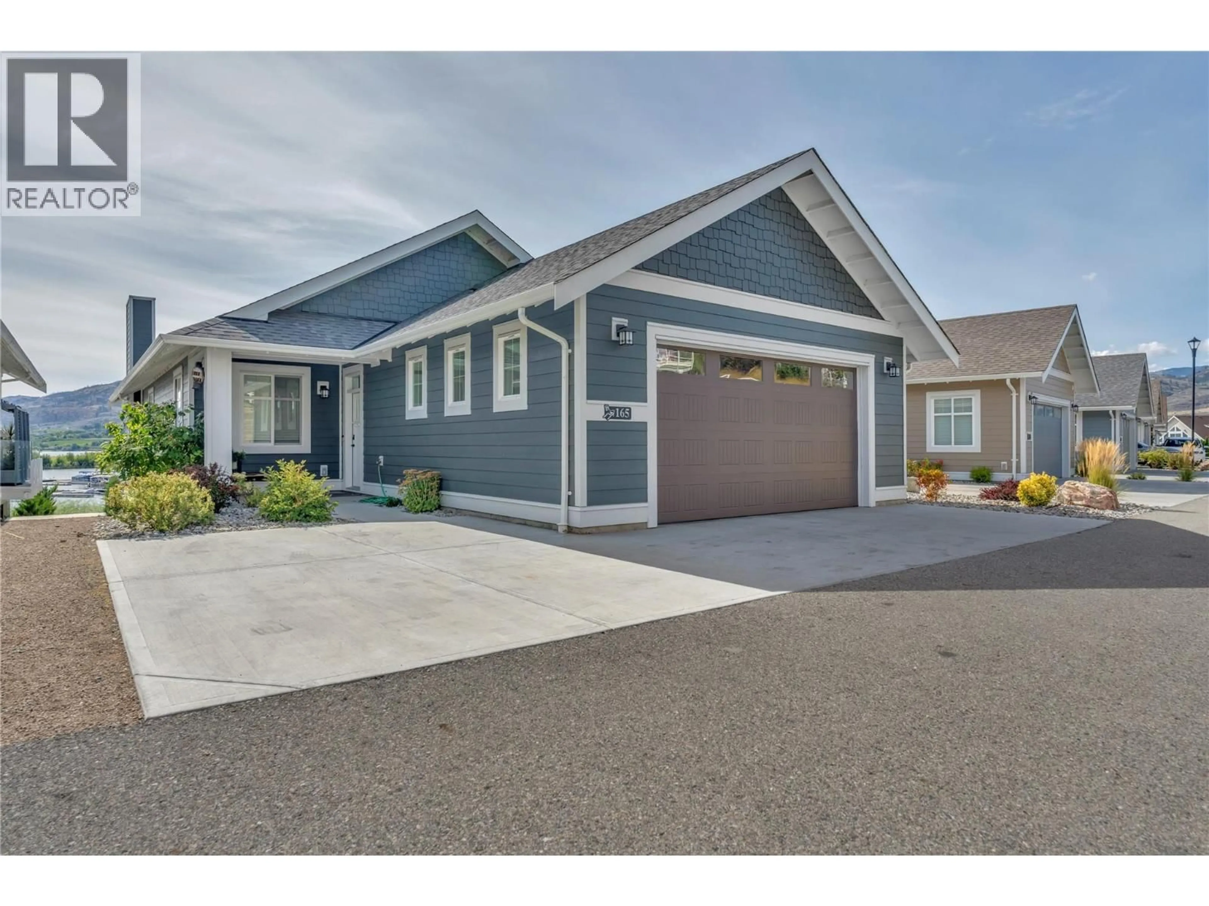 Home with vinyl exterior material, street for 165 - 2450 RADIO TOWER ROAD, Oliver British Columbia V0H1T1