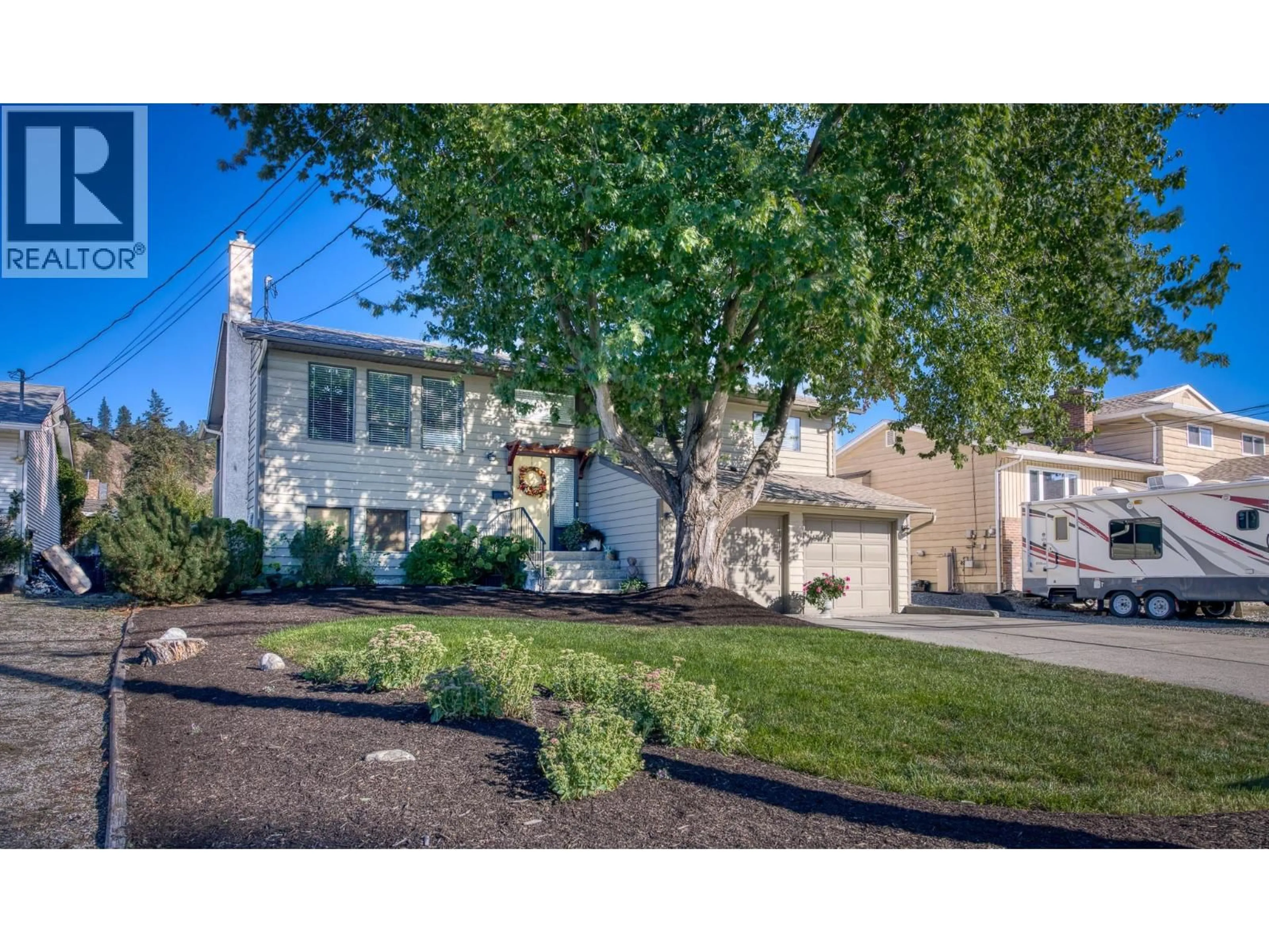 Home with vinyl exterior material, street for 4477 GORDON DRIVE, Kelowna British Columbia V1W1T2