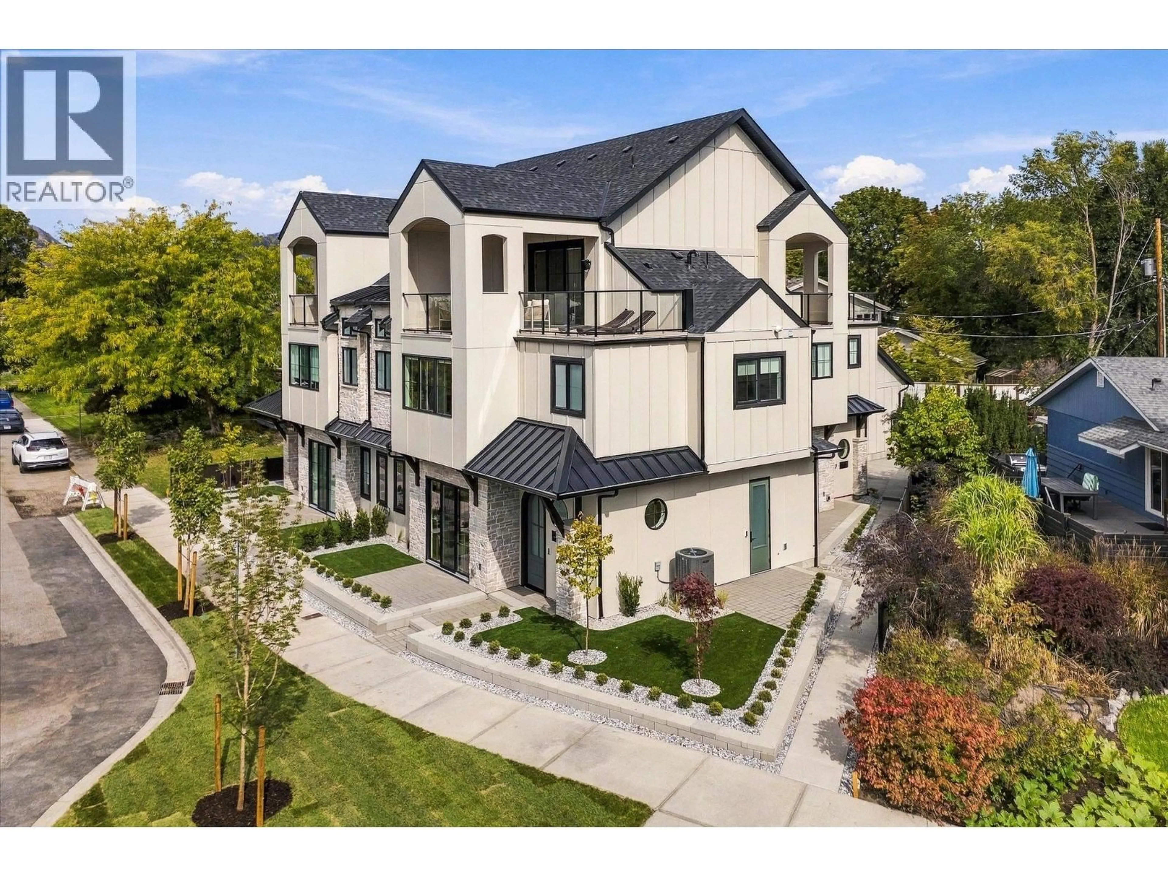 A pic from outside/outdoor area/front of a property/back of a property/a pic from drone, street for 4 - 2435 TAYLOR CRESCENT, Kelowna British Columbia V1Y1L9