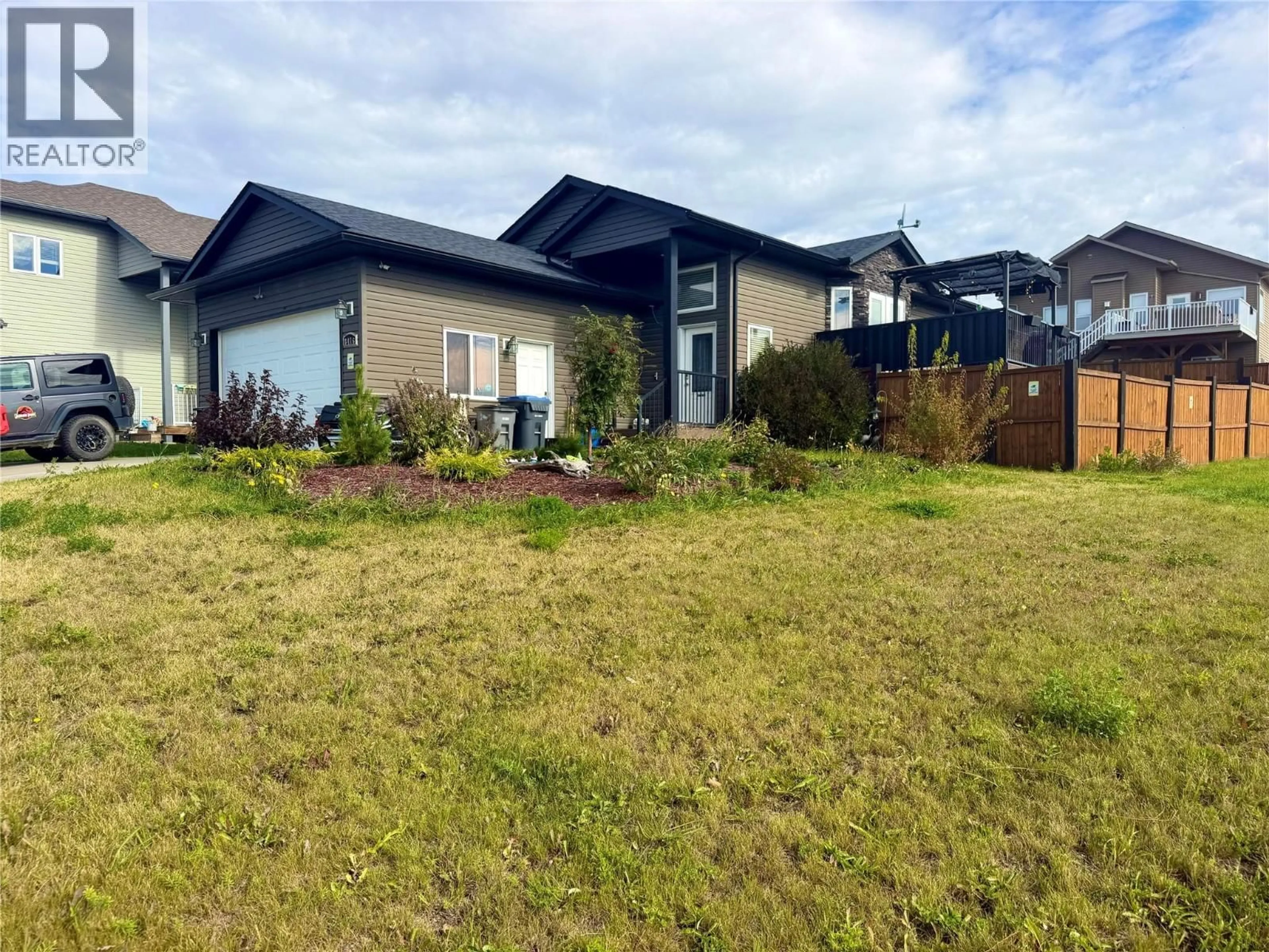 A pic from outside/outdoor area/front of a property/back of a property/a pic from drone, mountain view for 8416 18A STREET, Dawson Creek British Columbia V1G0E2