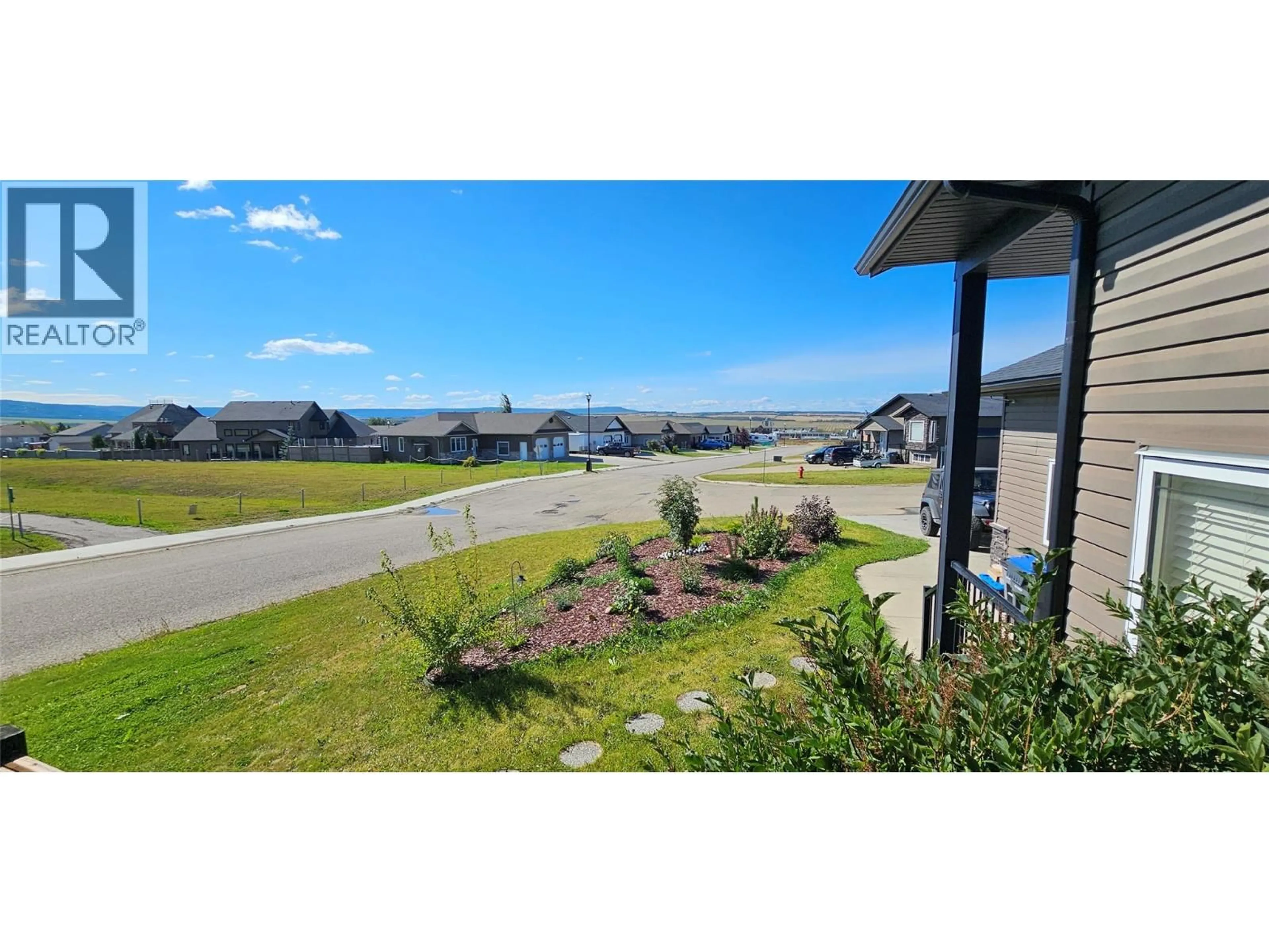 A pic from outside/outdoor area/front of a property/back of a property/a pic from drone, water/lake/river/ocean view for 8416 18A STREET, Dawson Creek British Columbia V1G0E2