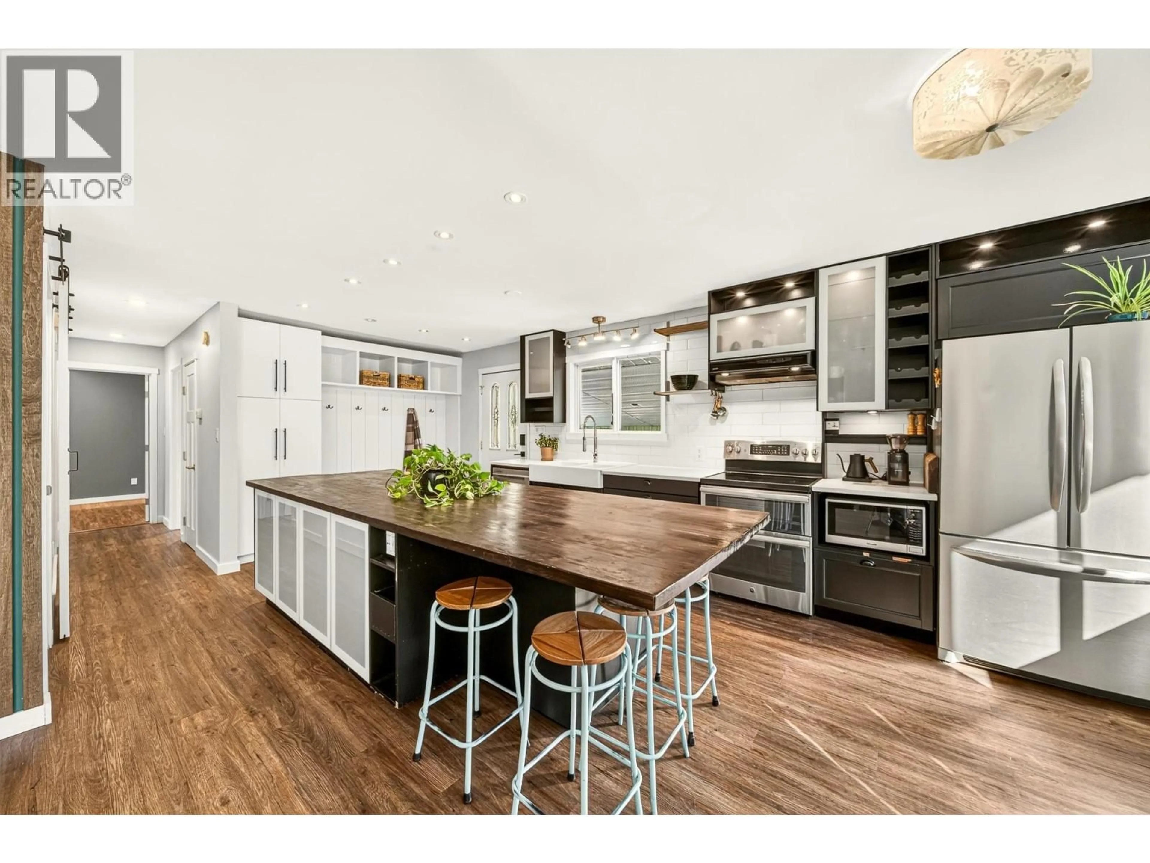 Open concept kitchen, wood/laminate floor for 231 BLUE SPRUCE CRESCENT, Sparwood British Columbia V0B2G0