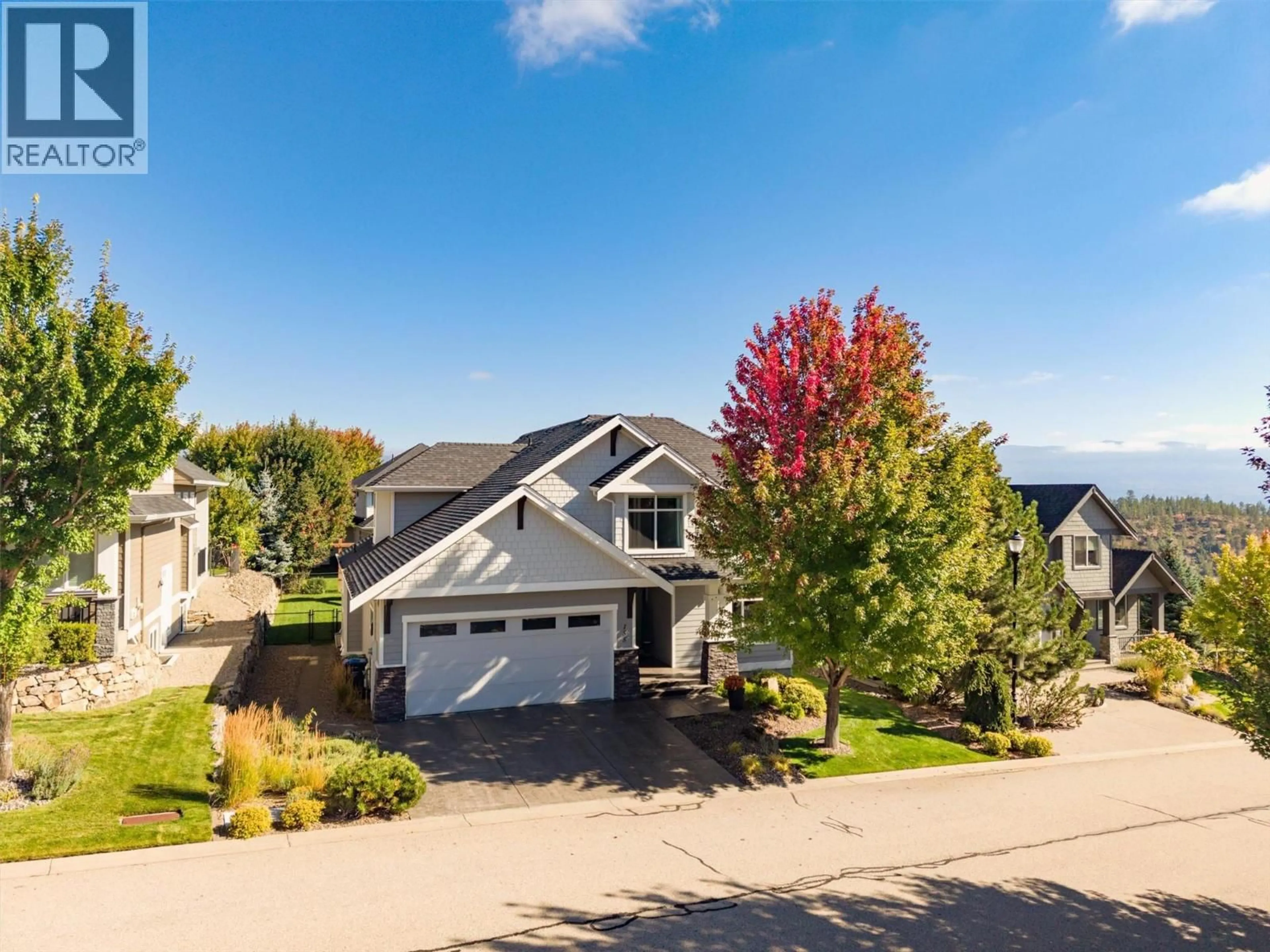 A pic from outside/outdoor area/front of a property/back of a property/a pic from drone, street for 155 SKYLAND DRIVE, Kelowna British Columbia V1V3A1