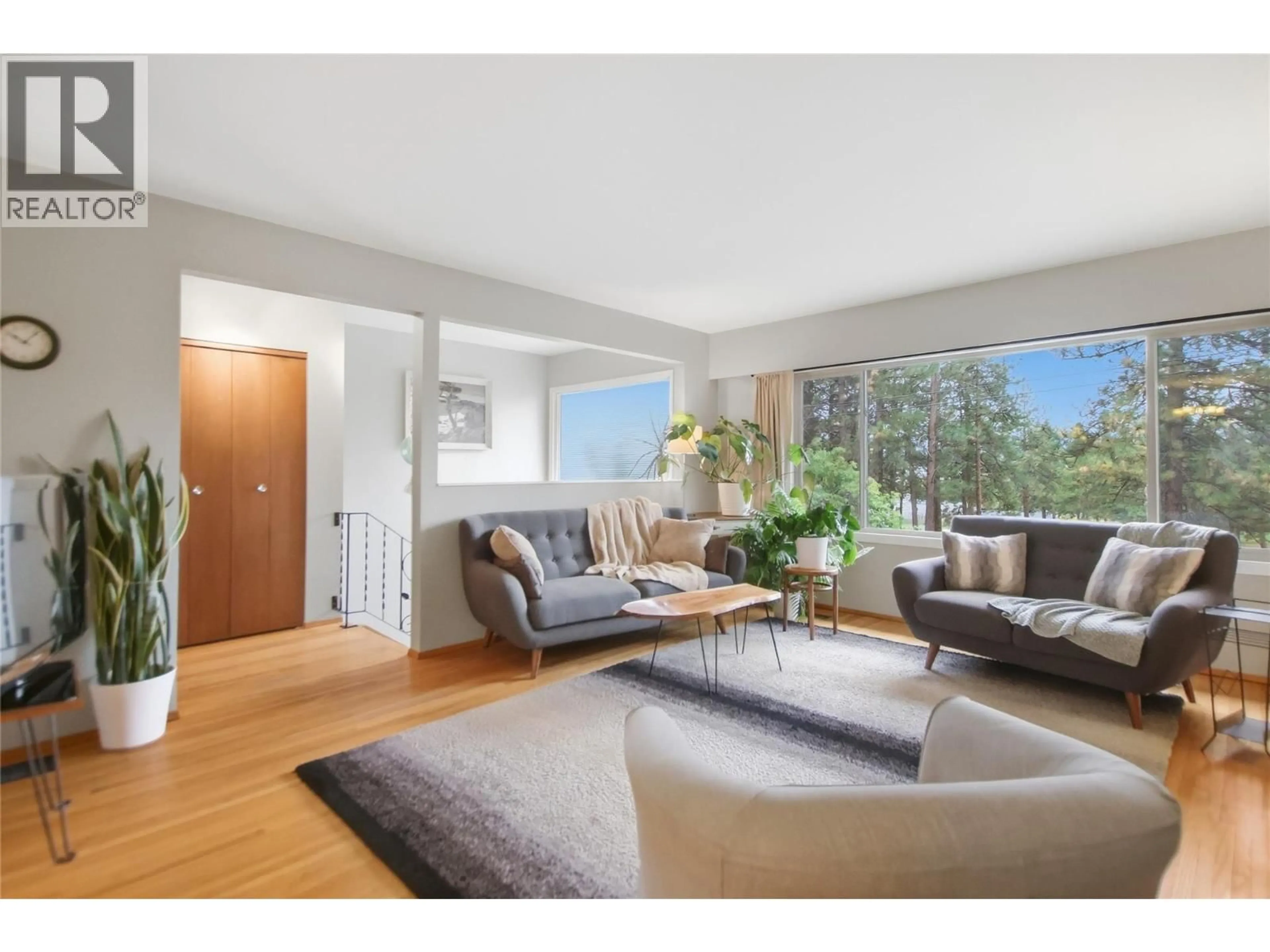 Living room with furniture, wood/laminate floor for 2175 MUNRO CRESCENT, Merritt British Columbia V1K1H7