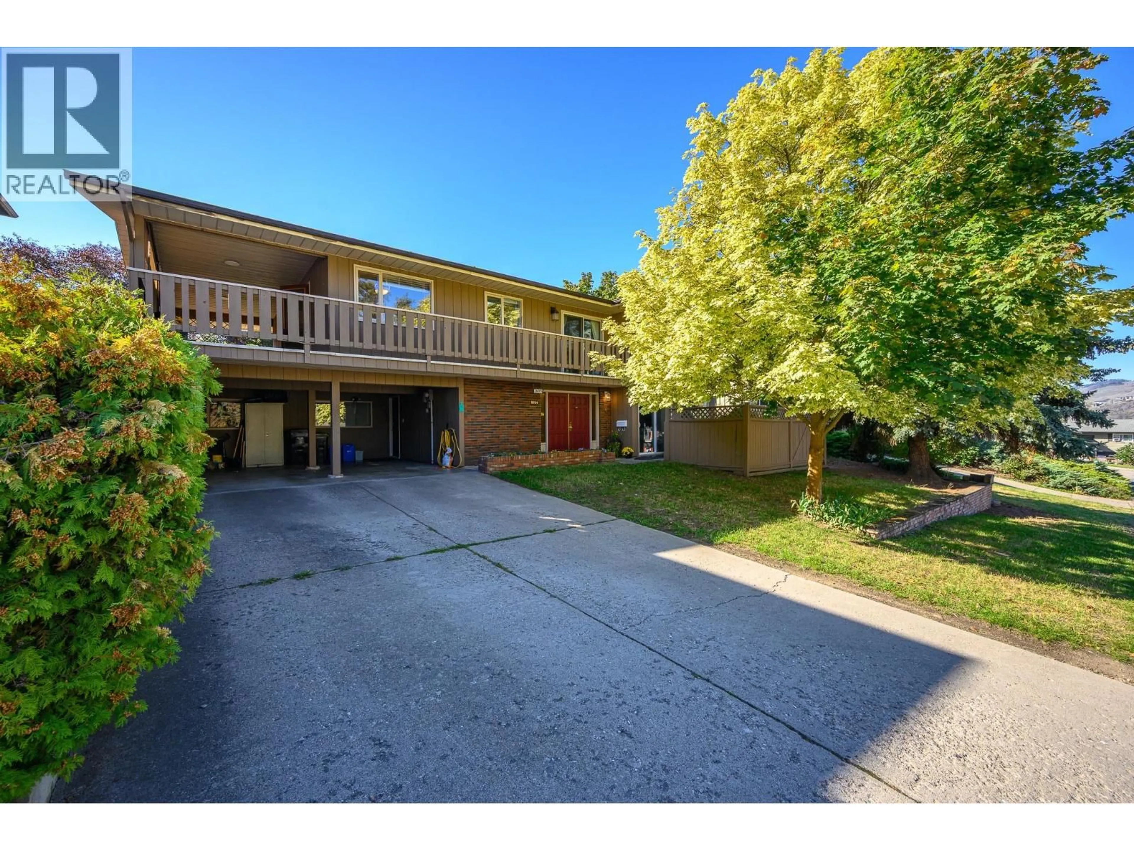 A pic from outside/outdoor area/front of a property/back of a property/a pic from drone, street for 1604 39A AVENUE, Vernon British Columbia V1T5C6