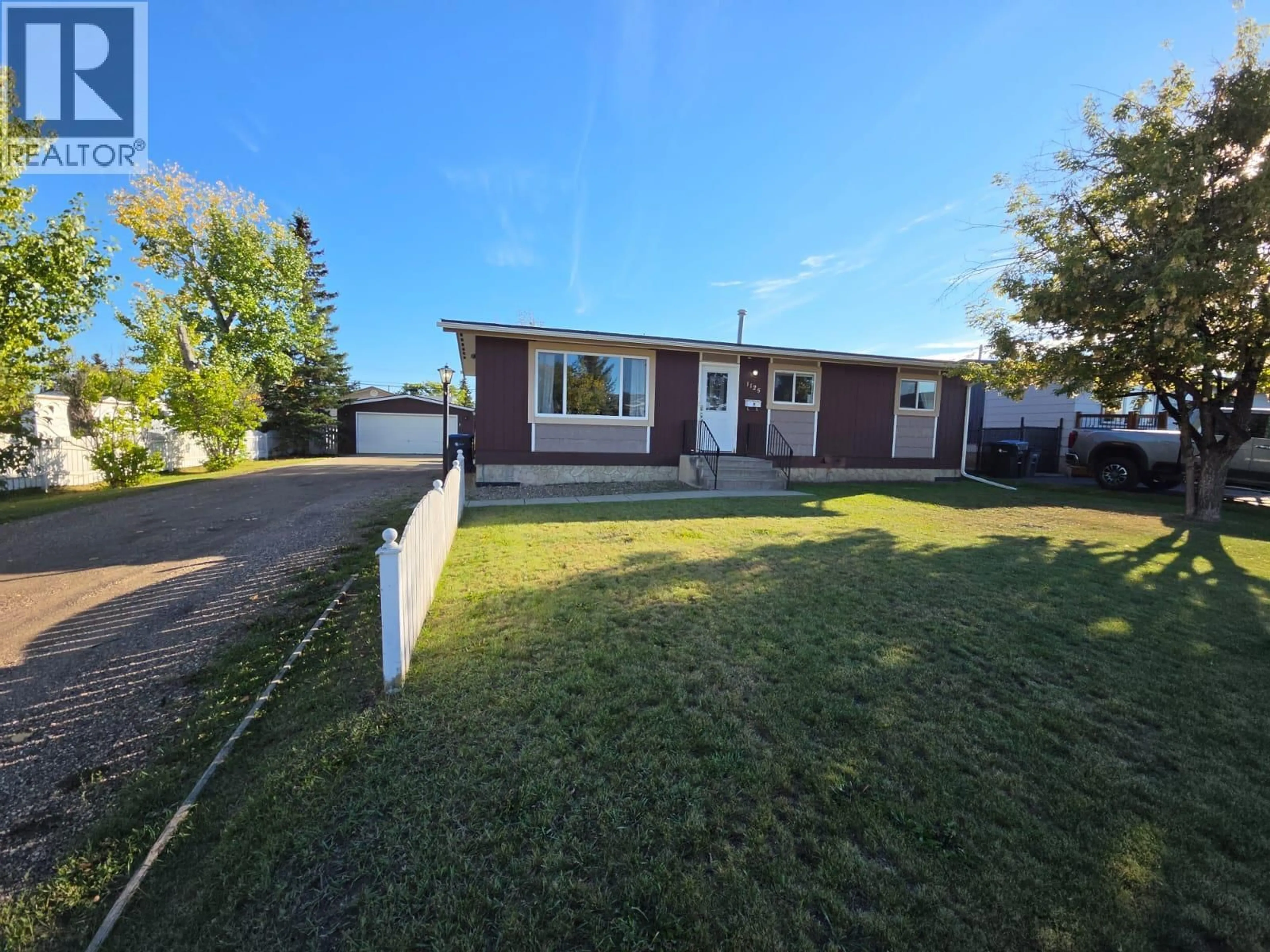 A pic from outside/outdoor area/front of a property/back of a property/a pic from drone, street for 1125 117 AVENUE, Dawson Creek British Columbia V1G3G8
