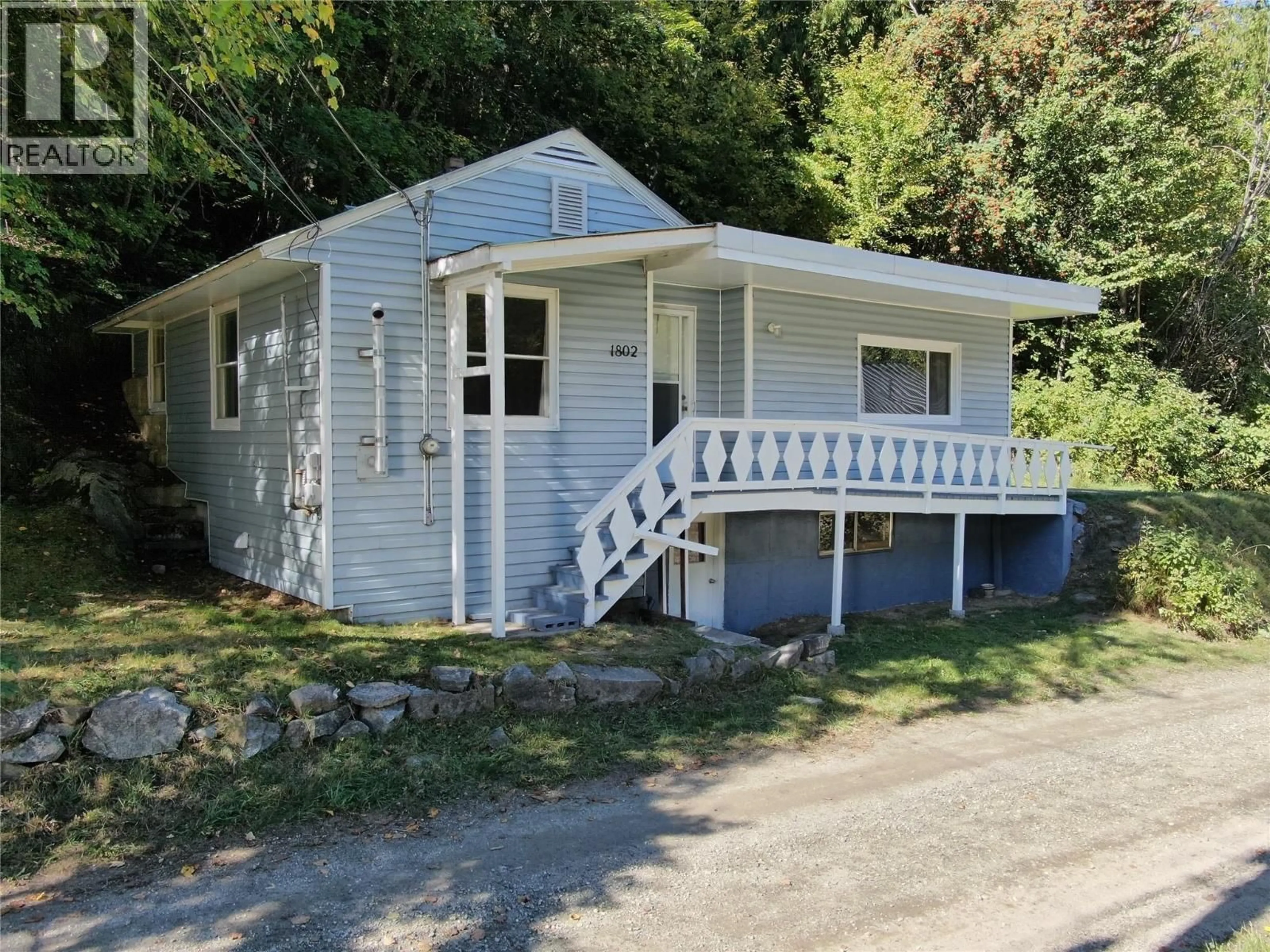 Home with vinyl exterior material, street for 1802 PERRIER ROAD, Nelson British Columbia V1L6Y8
