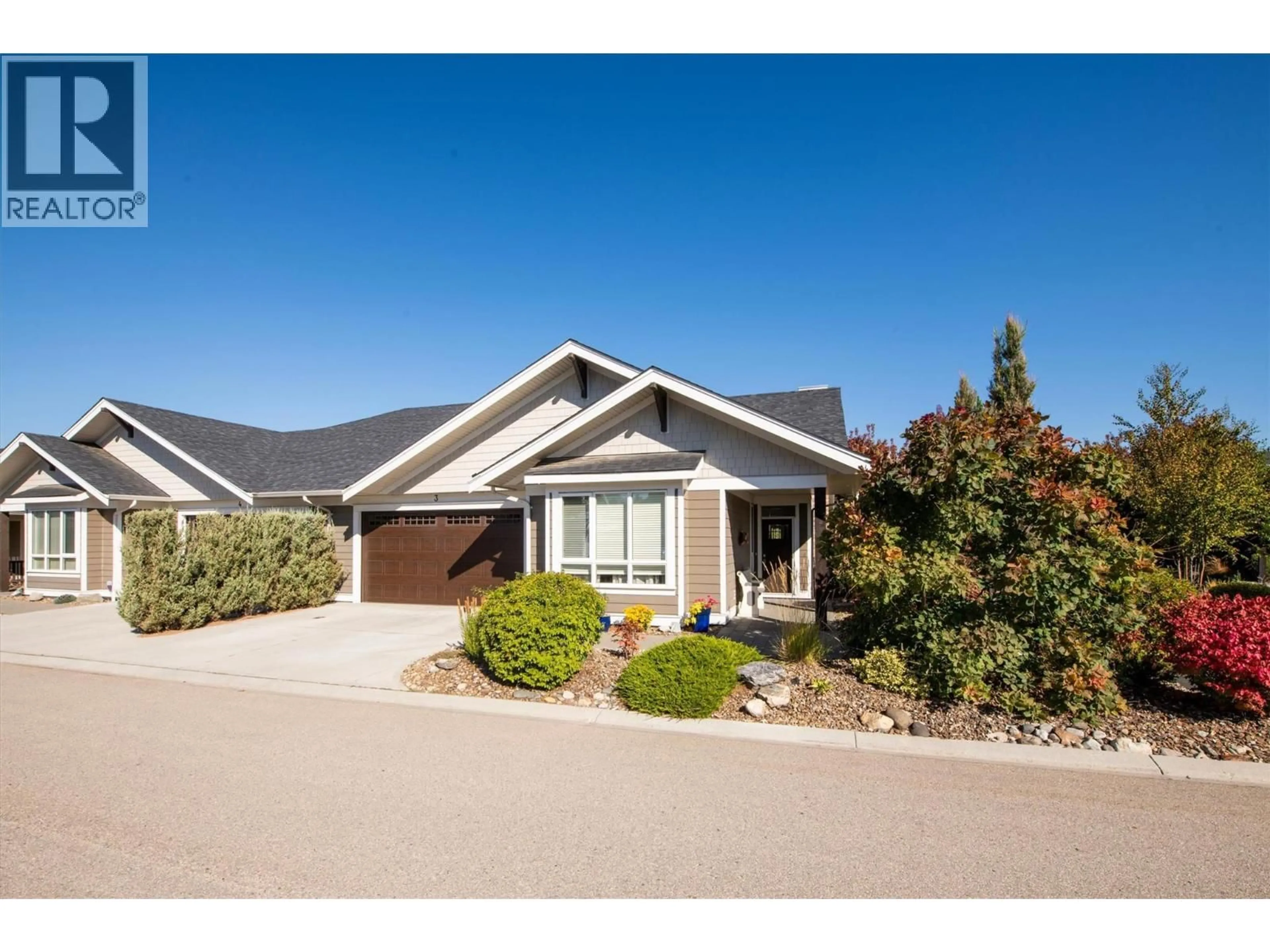 Home with vinyl exterior material, street for 3 - 1960 KLO ROAD, Kelowna British Columbia V1W5L2