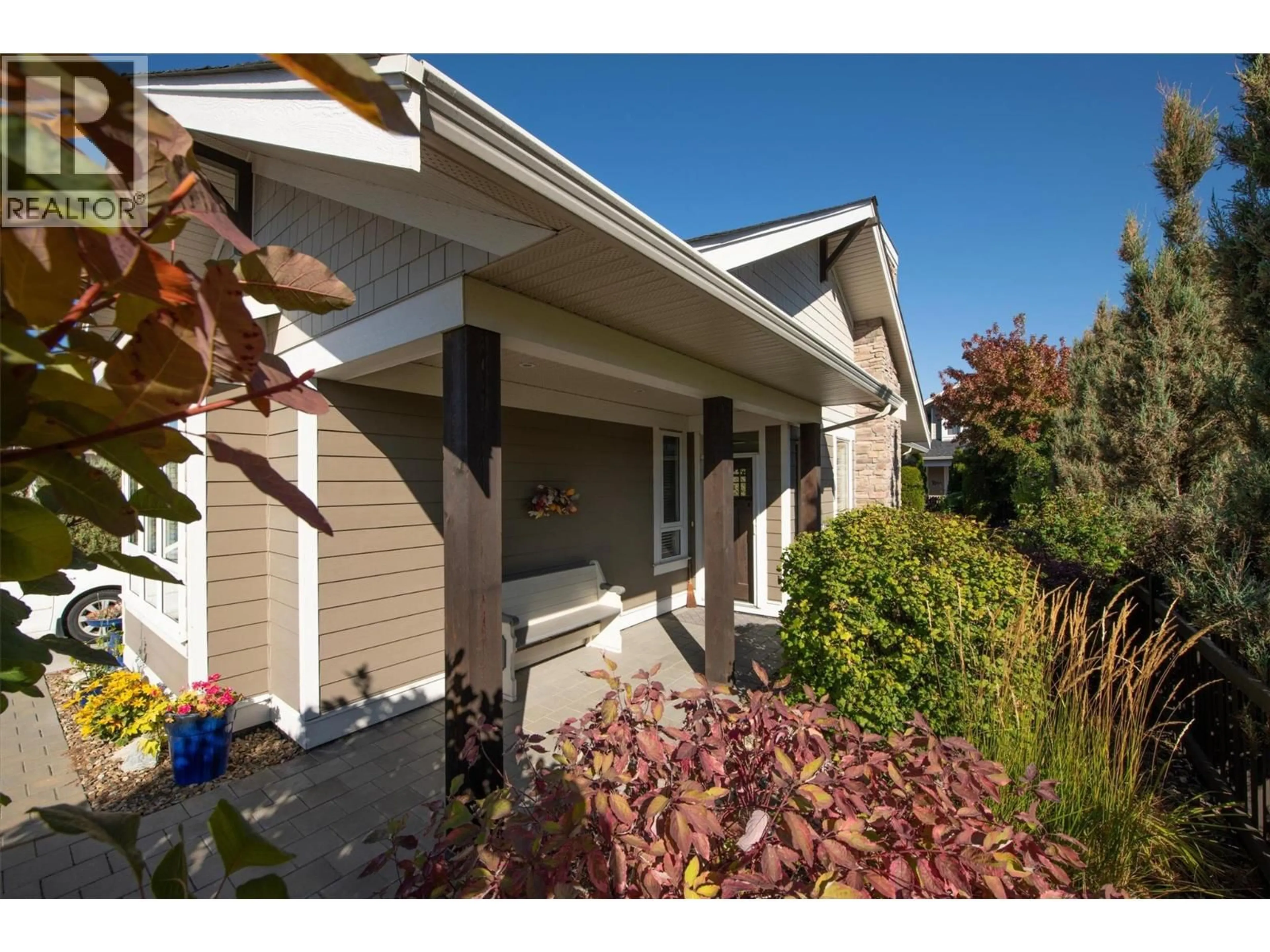 Home with vinyl exterior material, street for 3 - 1960 KLO ROAD, Kelowna British Columbia V1W5L2