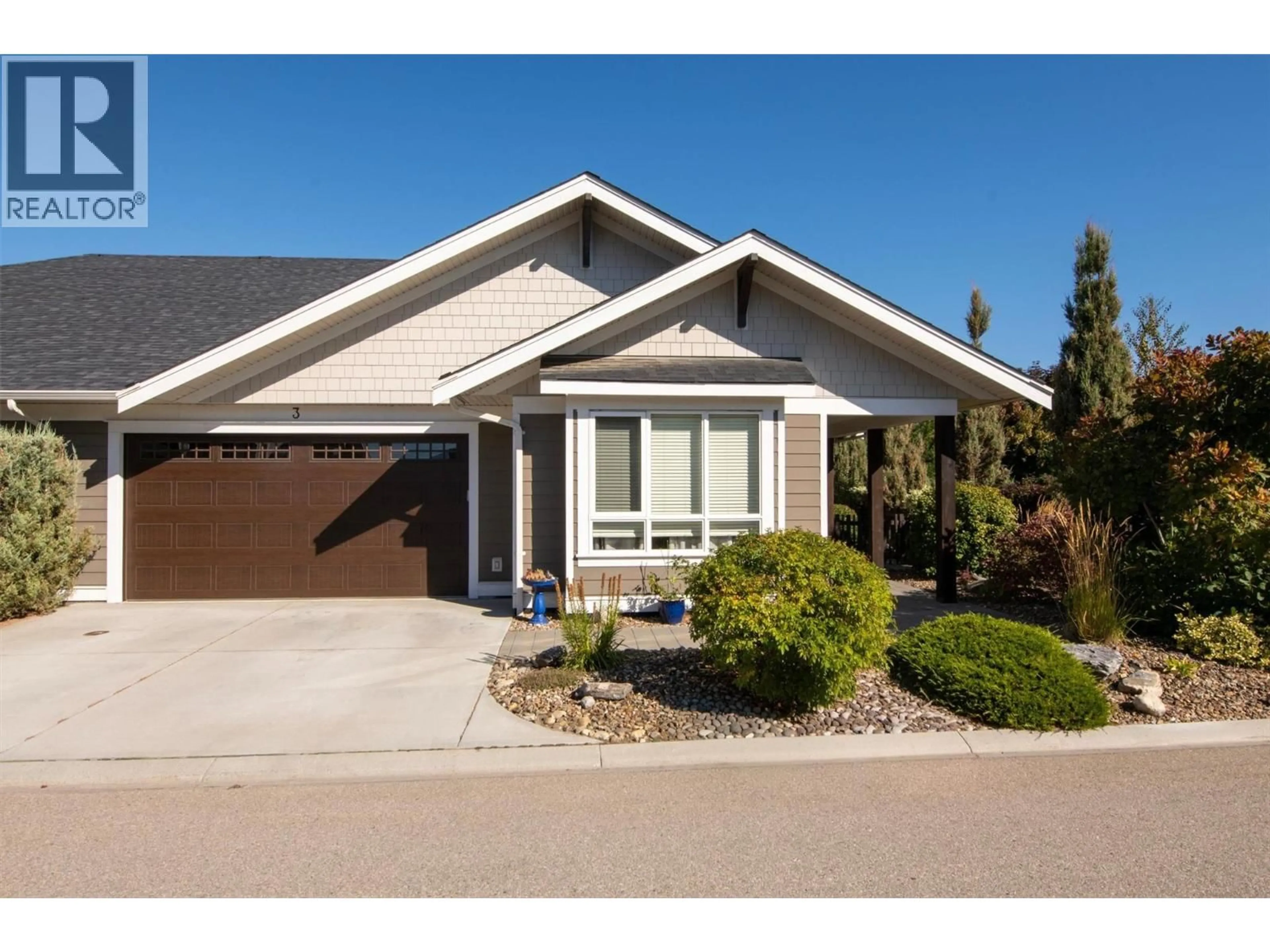 Home with vinyl exterior material, street for 3 - 1960 KLO ROAD, Kelowna British Columbia V1W5L2