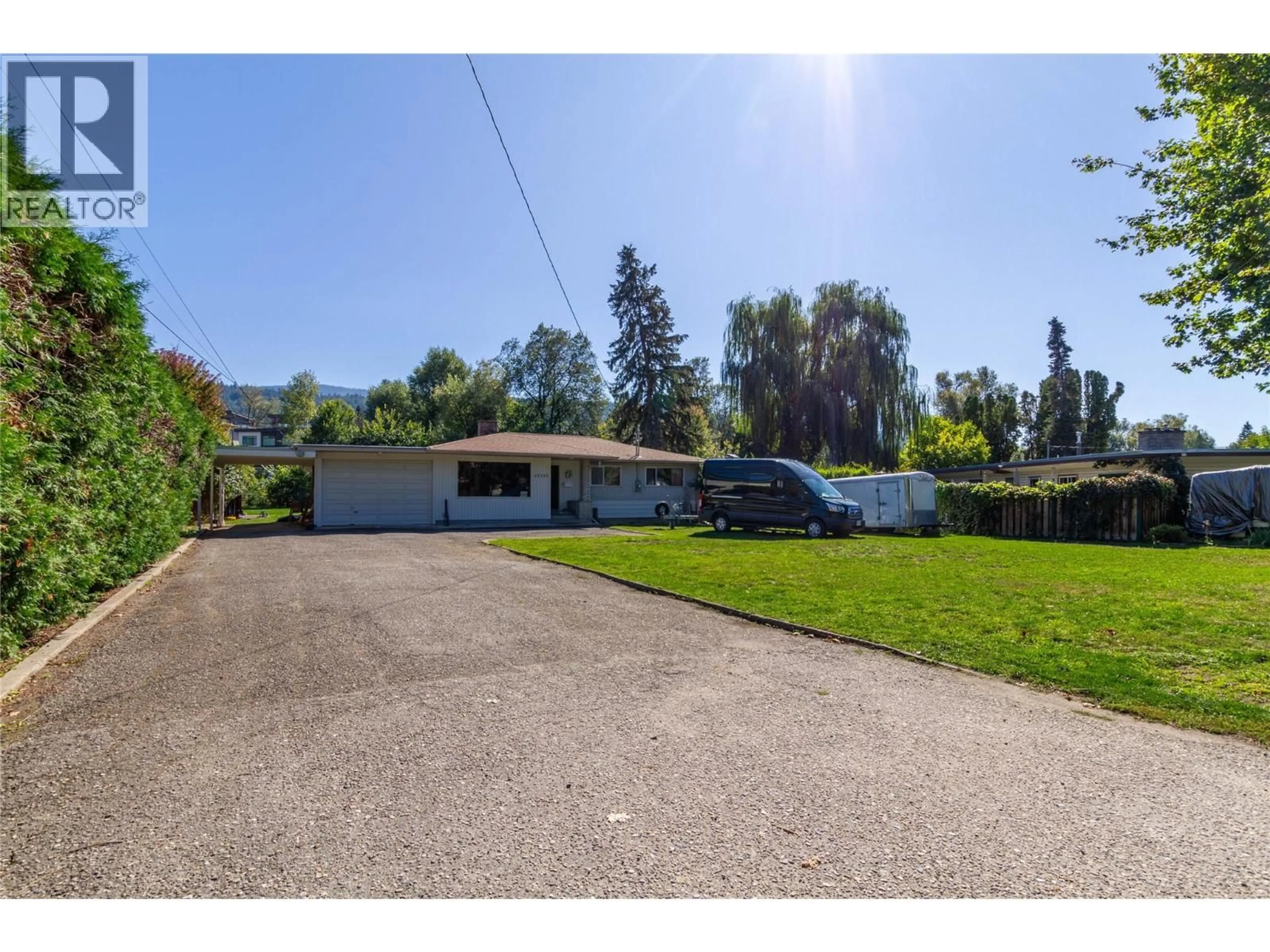 A pic from outside/outdoor area/front of a property/back of a property/a pic from drone, street for 12310 KALAVISTA DRIVE, Coldstream British Columbia V1B1K5