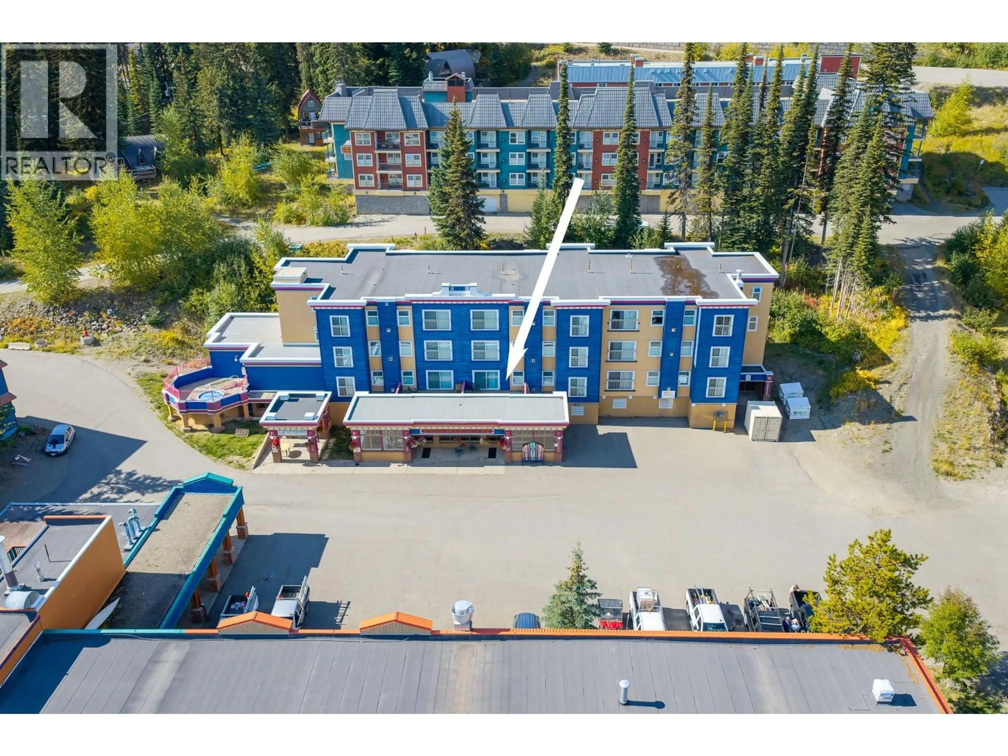 A pic from outside/outdoor area/front of a property/back of a property/a pic from drone, building for 233/234 - 150 SILVER LODE LANE, Silver Star British Columbia V1B3M1