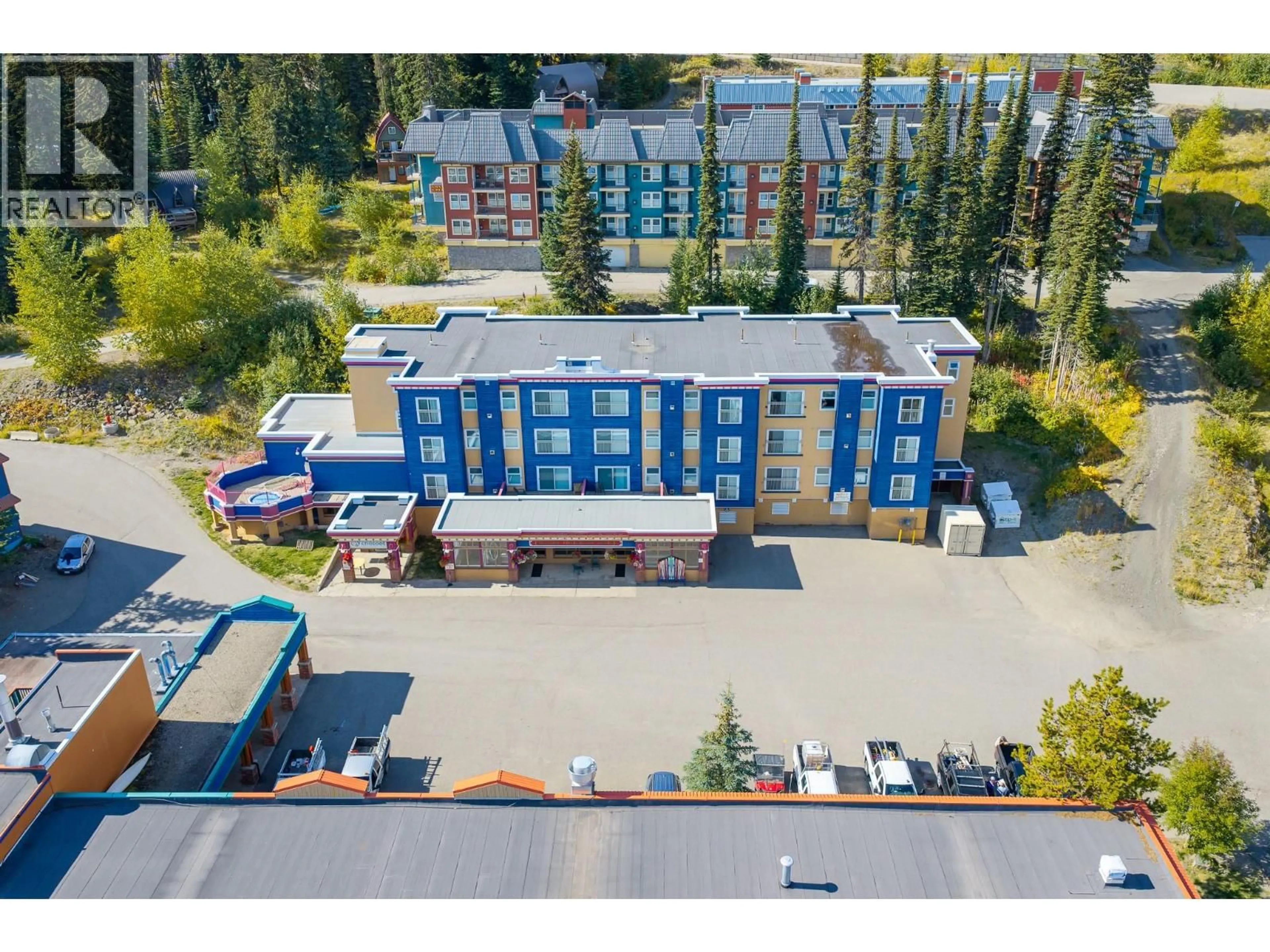 A pic from outside/outdoor area/front of a property/back of a property/a pic from drone, unknown for 233/234 - 150 SILVER LODE LANE, Silver Star British Columbia V1B3M1