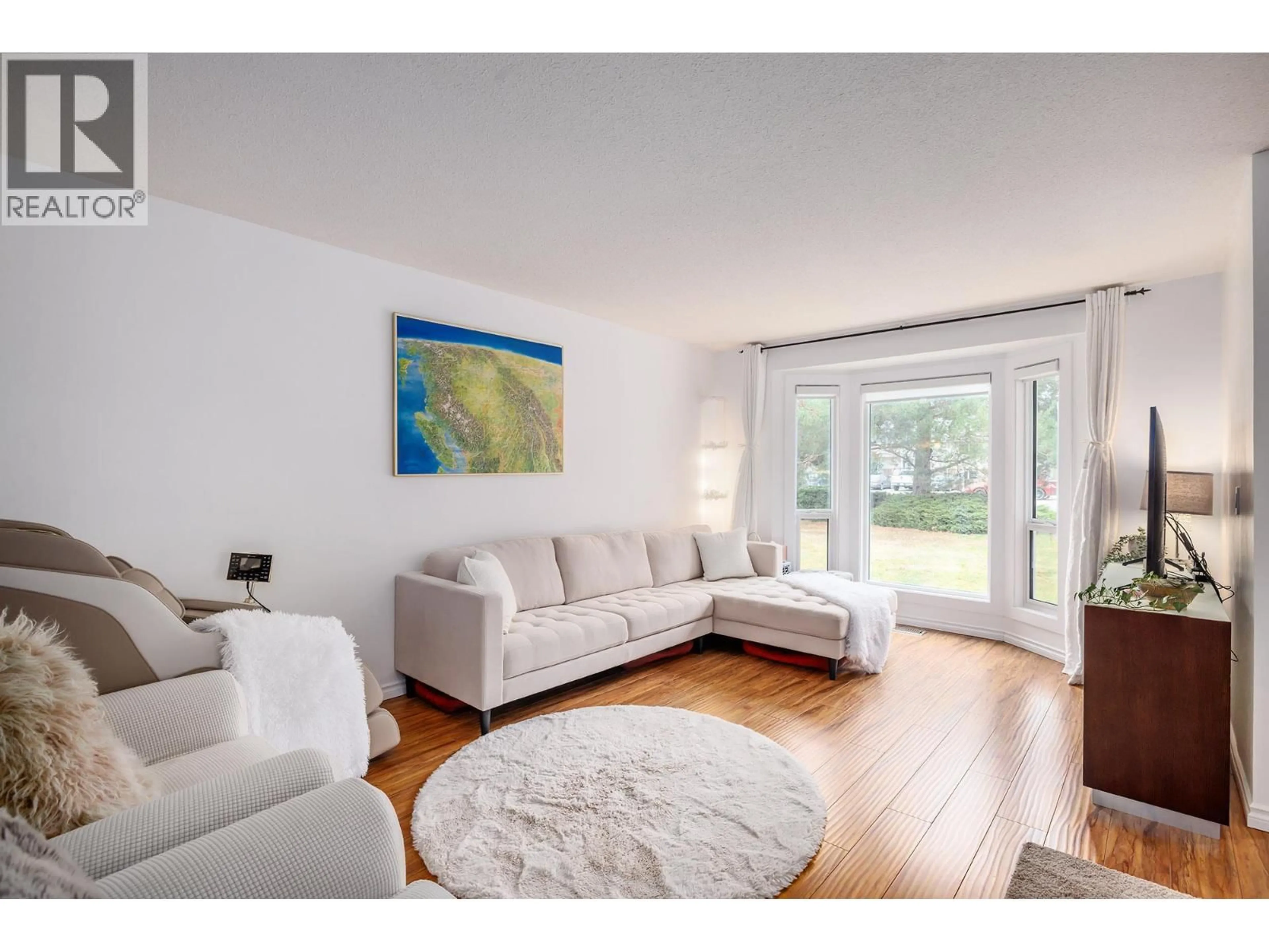 Living room with furniture, wood/laminate floor for 2754 CAMERON ROAD, West Kelowna British Columbia V1Z3K5