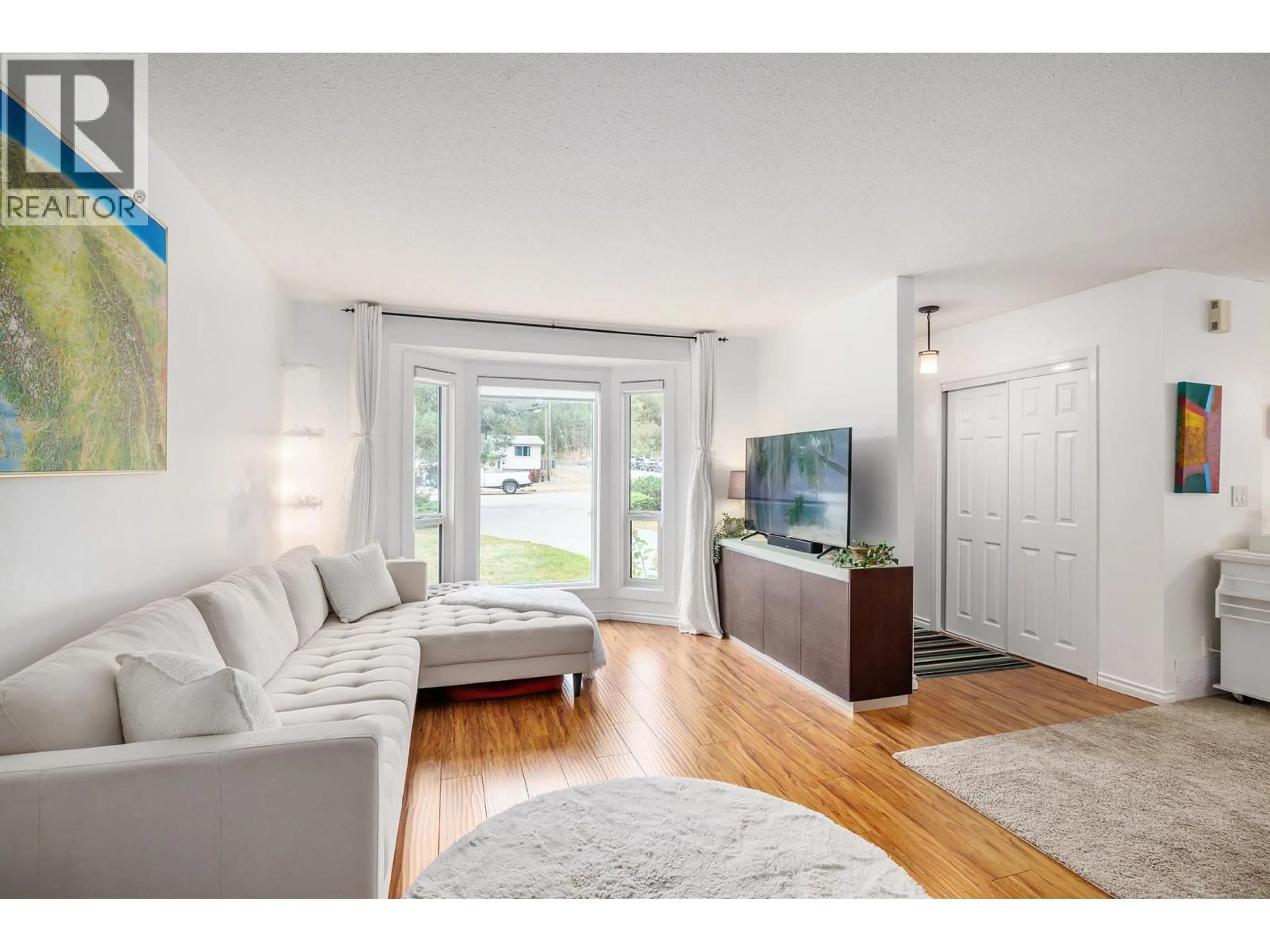 Living room with furniture, wood/laminate floor for 2754 CAMERON ROAD, West Kelowna British Columbia V1Z3K5