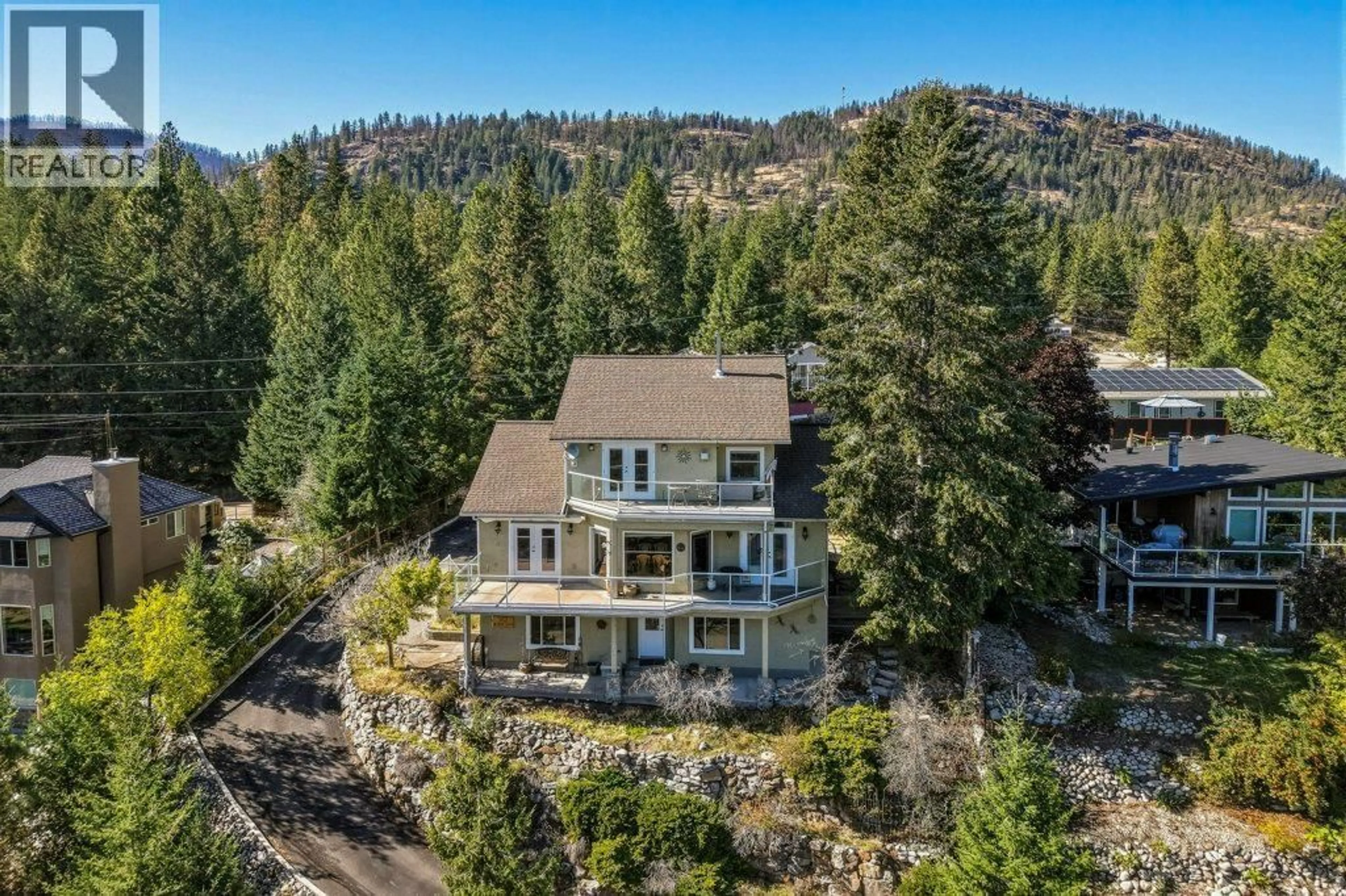 A pic from outside/outdoor area/front of a property/back of a property/a pic from drone, unknown for 562 MOUNTAIN DRIVE, Vernon British Columbia V1H2B7