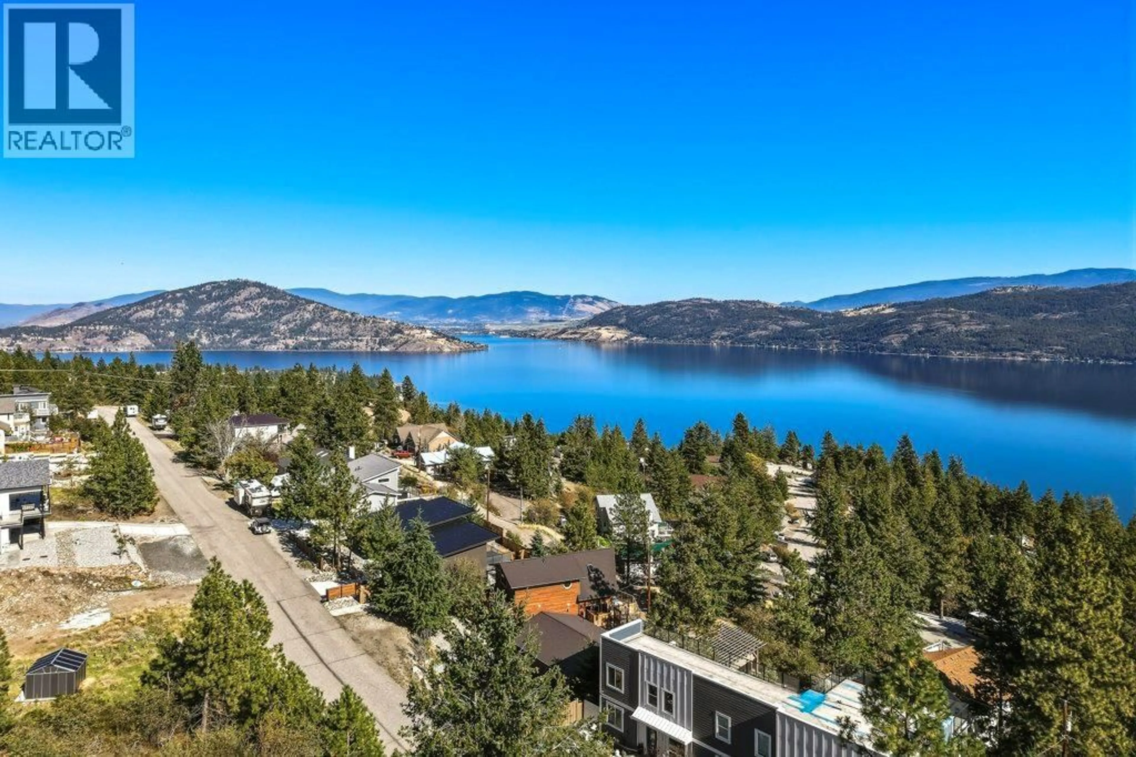 A pic from outside/outdoor area/front of a property/back of a property/a pic from drone, water/lake/river/ocean view for 562 MOUNTAIN DRIVE, Vernon British Columbia V1H2B7