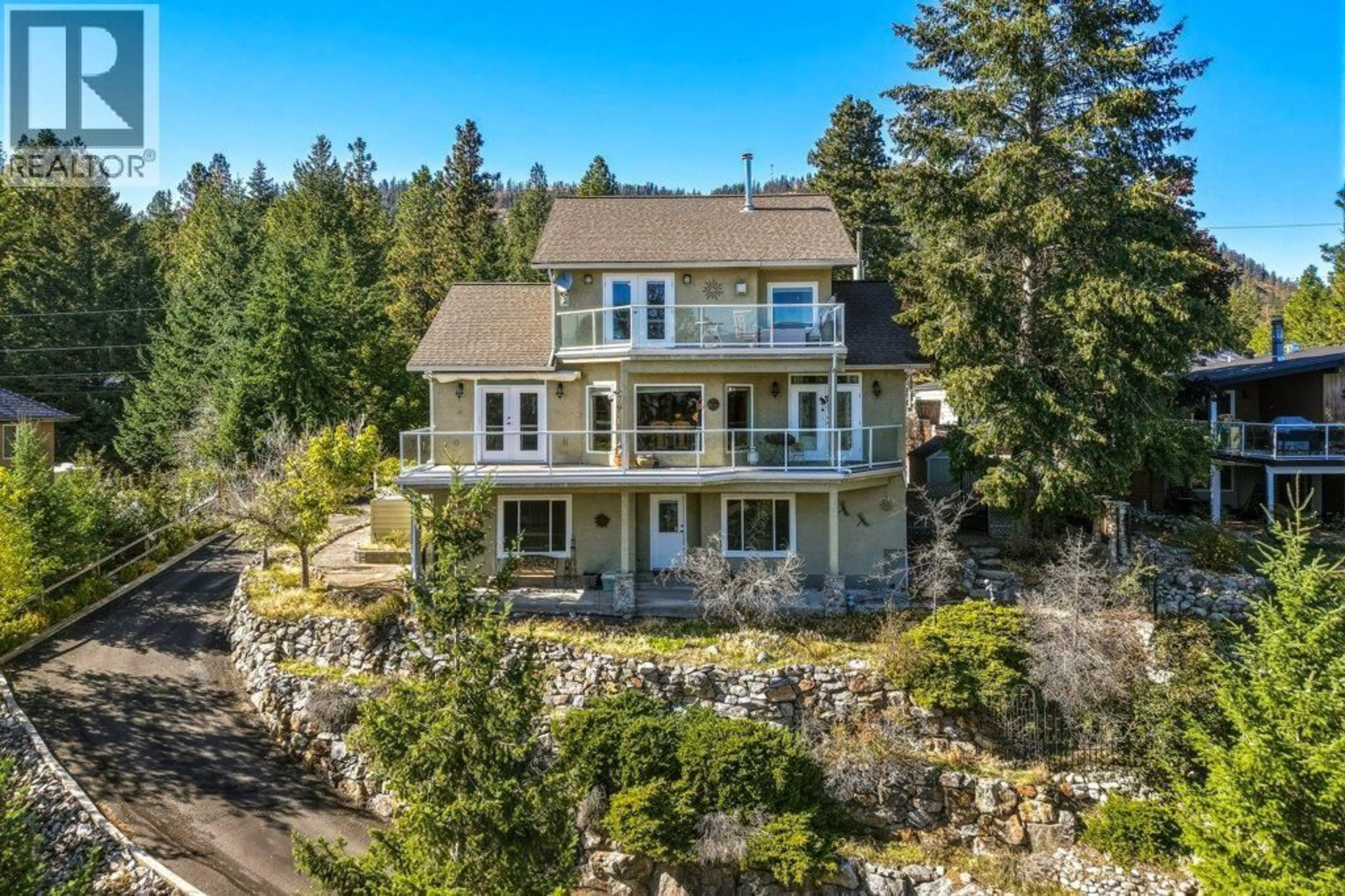 A pic from outside/outdoor area/front of a property/back of a property/a pic from drone, water/lake/river/ocean view for 562 MOUNTAIN DRIVE, Vernon British Columbia V1H2B7