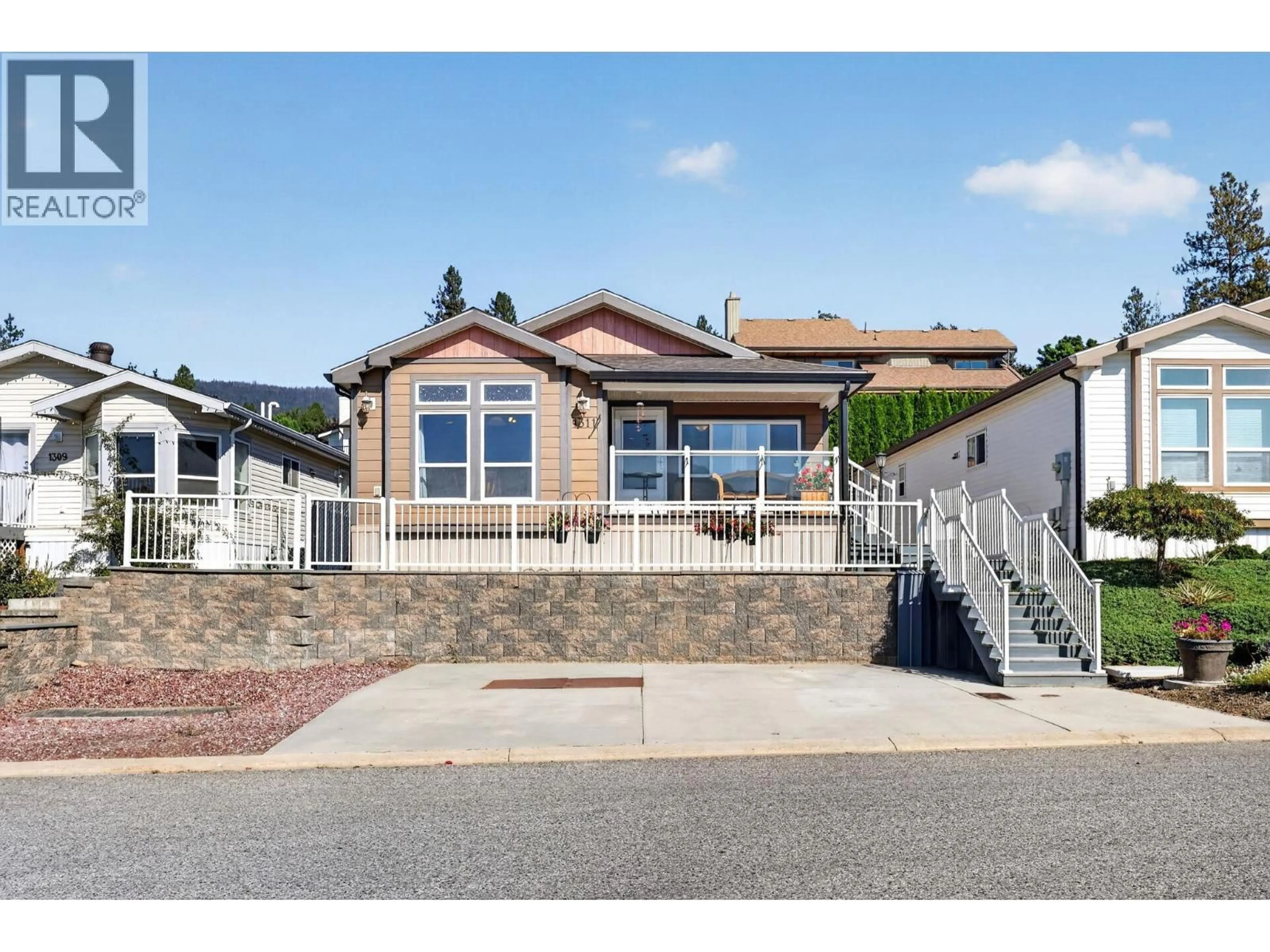 Home with vinyl exterior material, street for 1311 - 2440 OLD OKANAGAN HIGHWAY, Westbank British Columbia V4T3A2