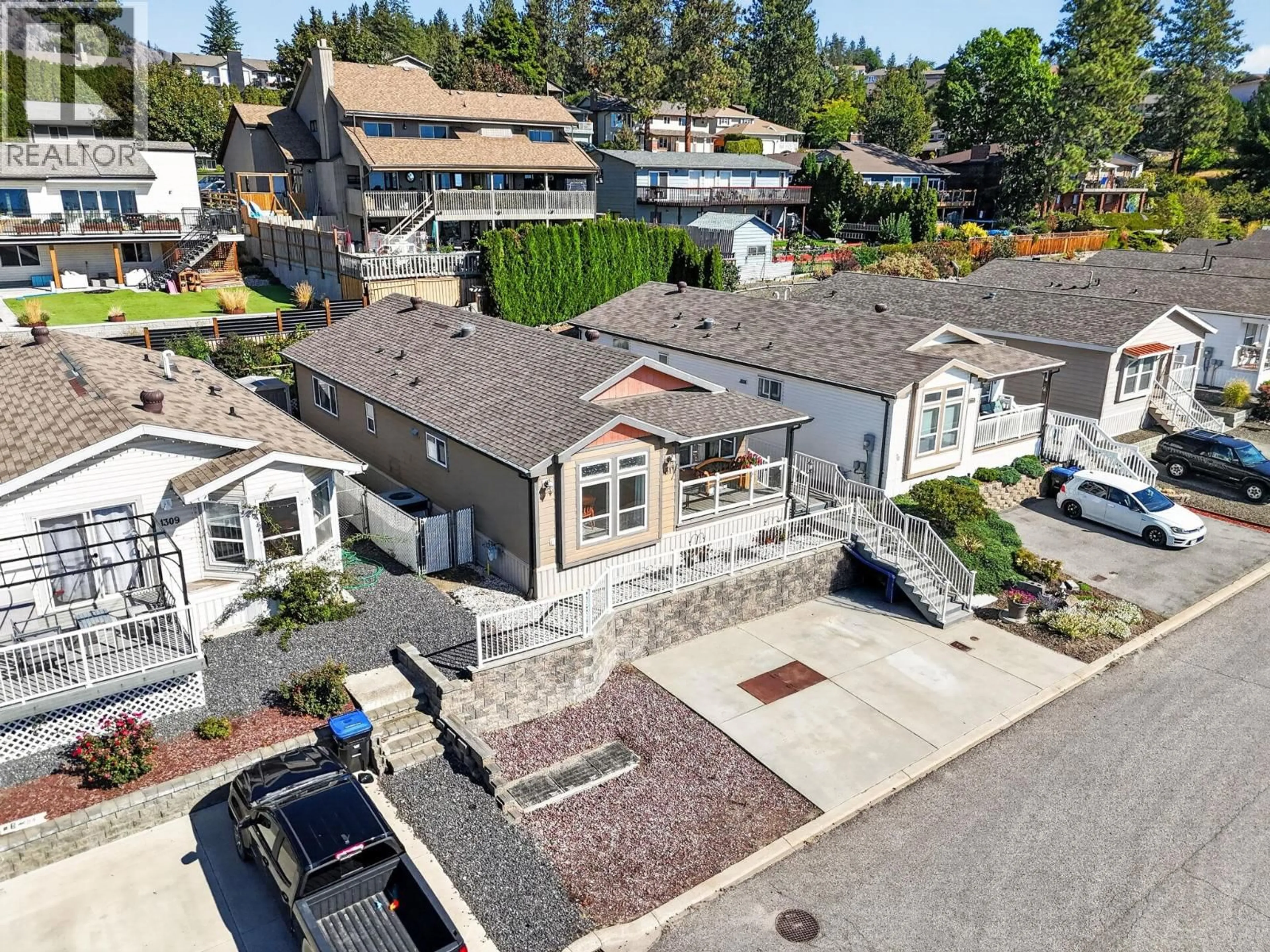A pic from outside/outdoor area/front of a property/back of a property/a pic from drone, street for 1311 - 2440 OLD OKANAGAN HIGHWAY, Westbank British Columbia V4T3A2