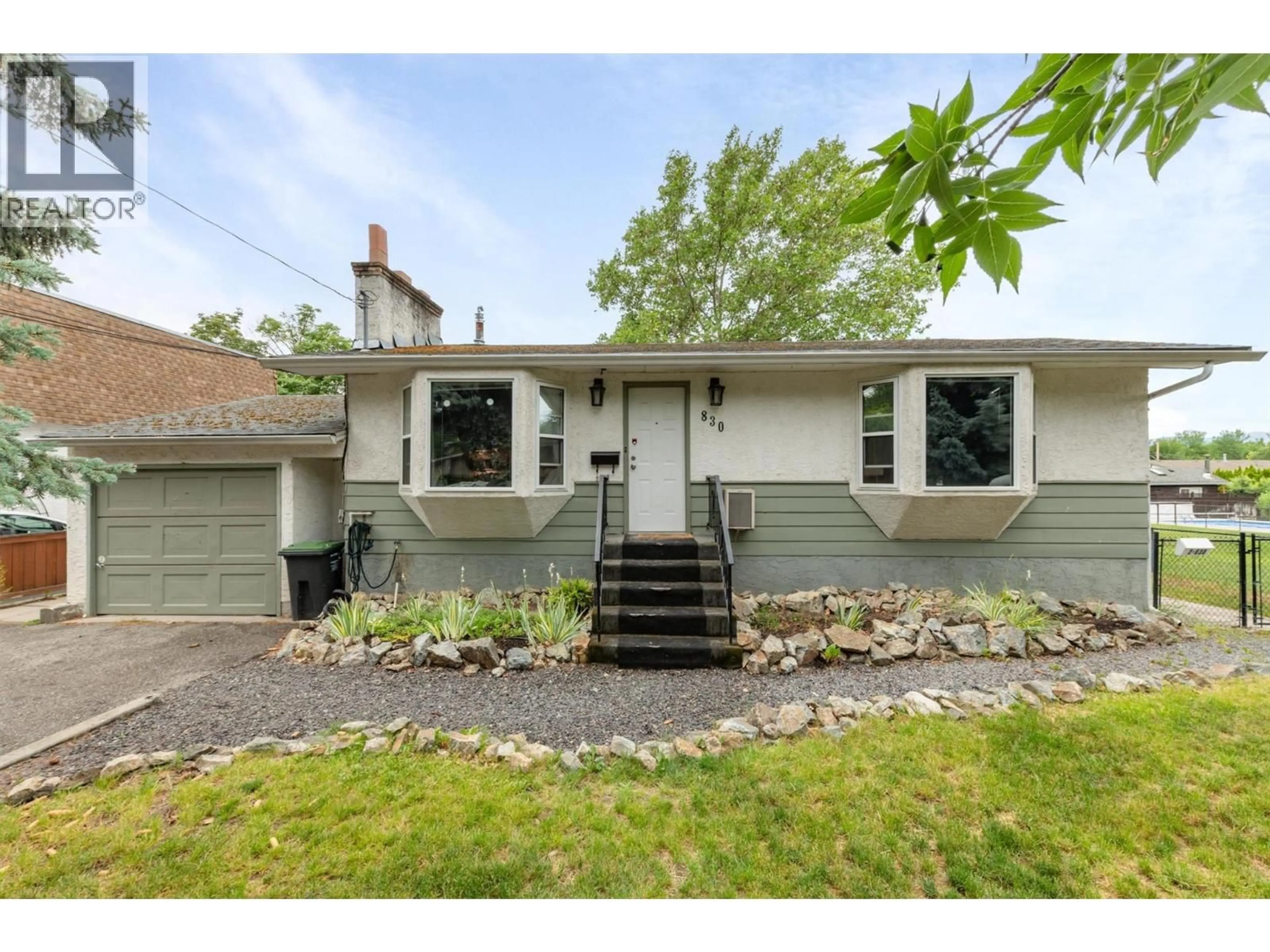 Home with vinyl exterior material, street for 830 MITCHELL ROAD, Kelowna British Columbia V1X3W5