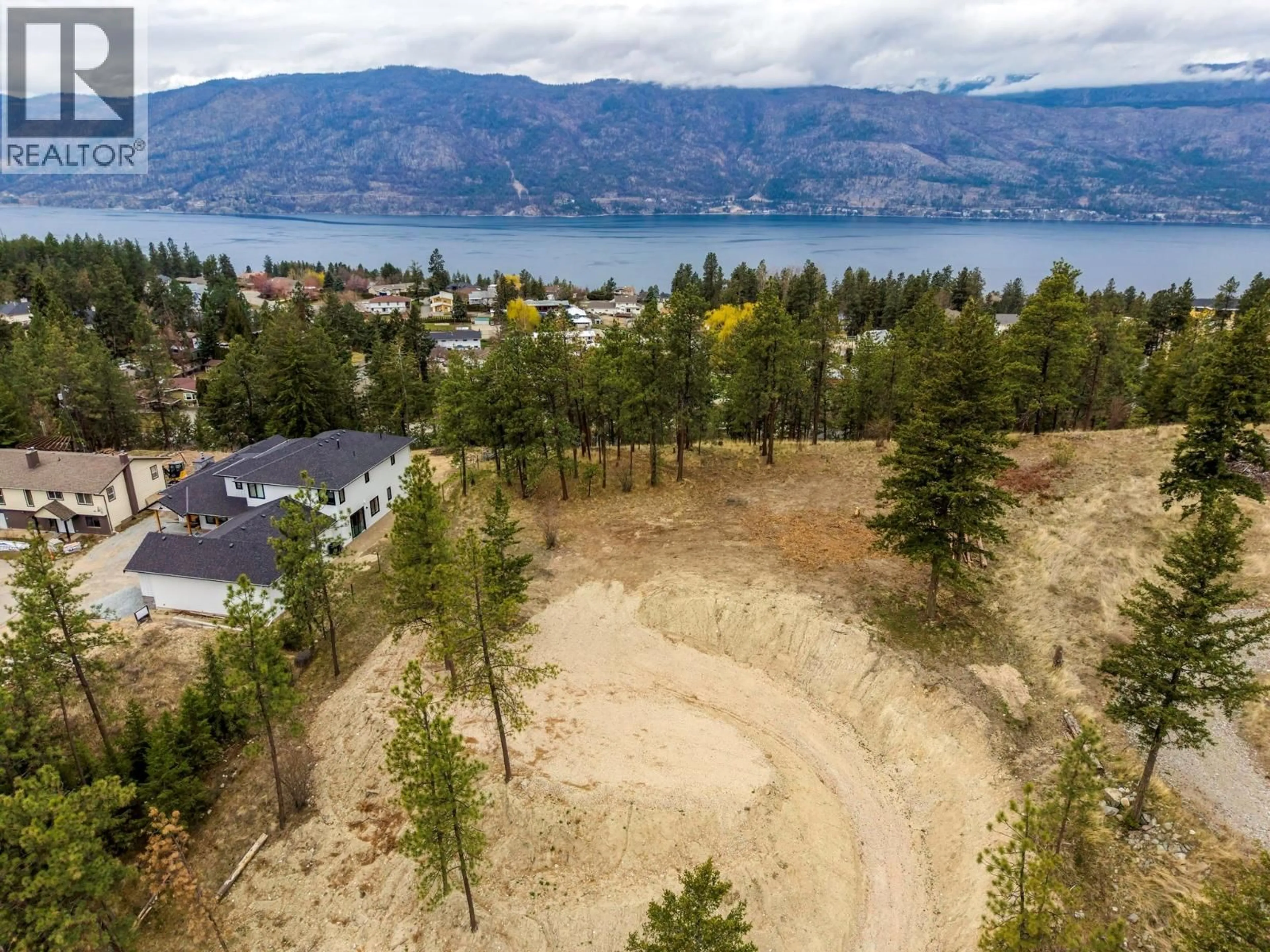 A pic from outside/outdoor area/front of a property/back of a property/a pic from drone, water/lake/river/ocean view for 11011 HALLAM DRIVE, Lake Country British Columbia V4V1P2
