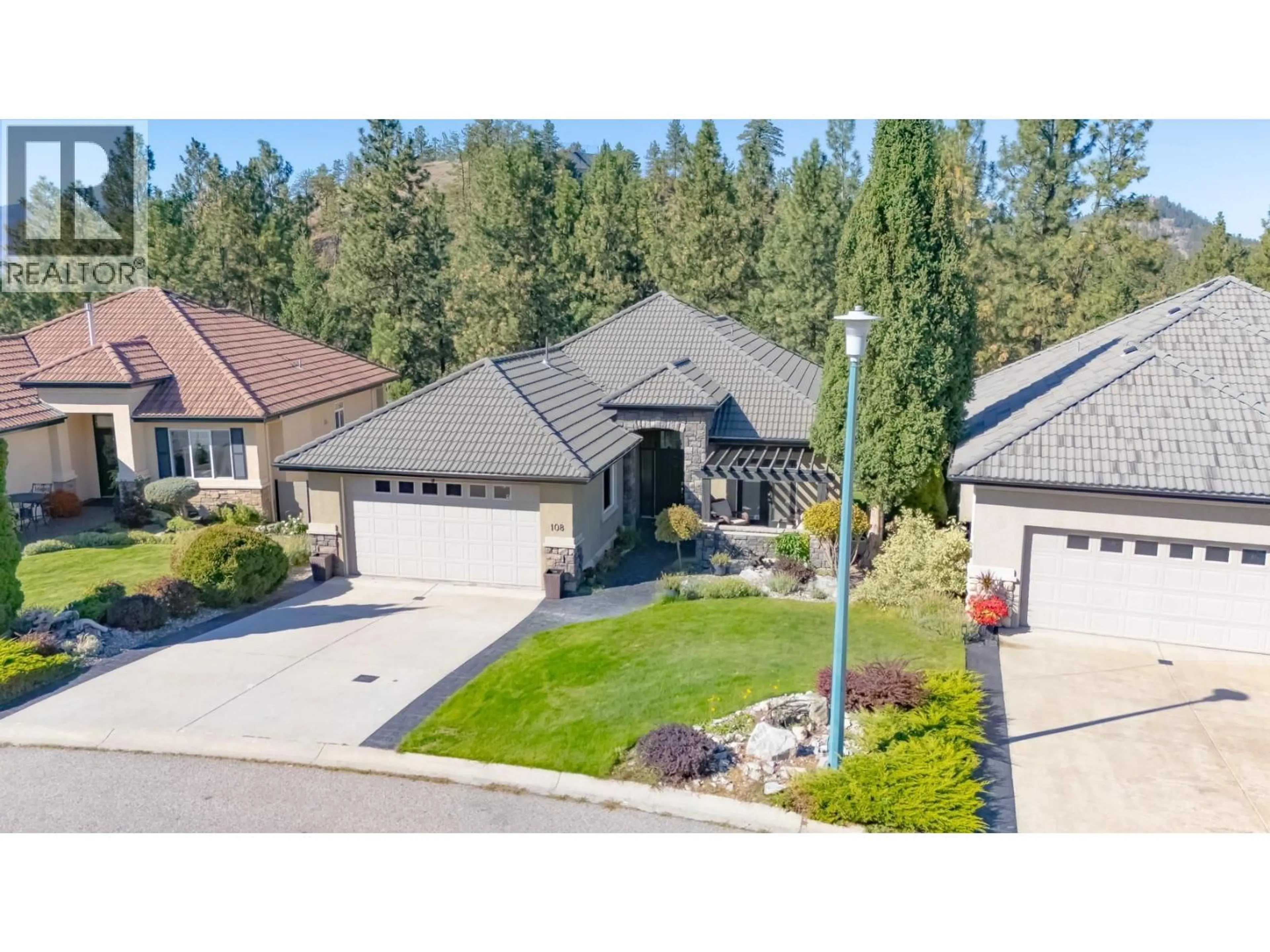 A pic from outside/outdoor area/front of a property/back of a property/a pic from drone, street for 108 - 1950 CAPISTRANO DRIVE, Kelowna British Columbia V1V2N7