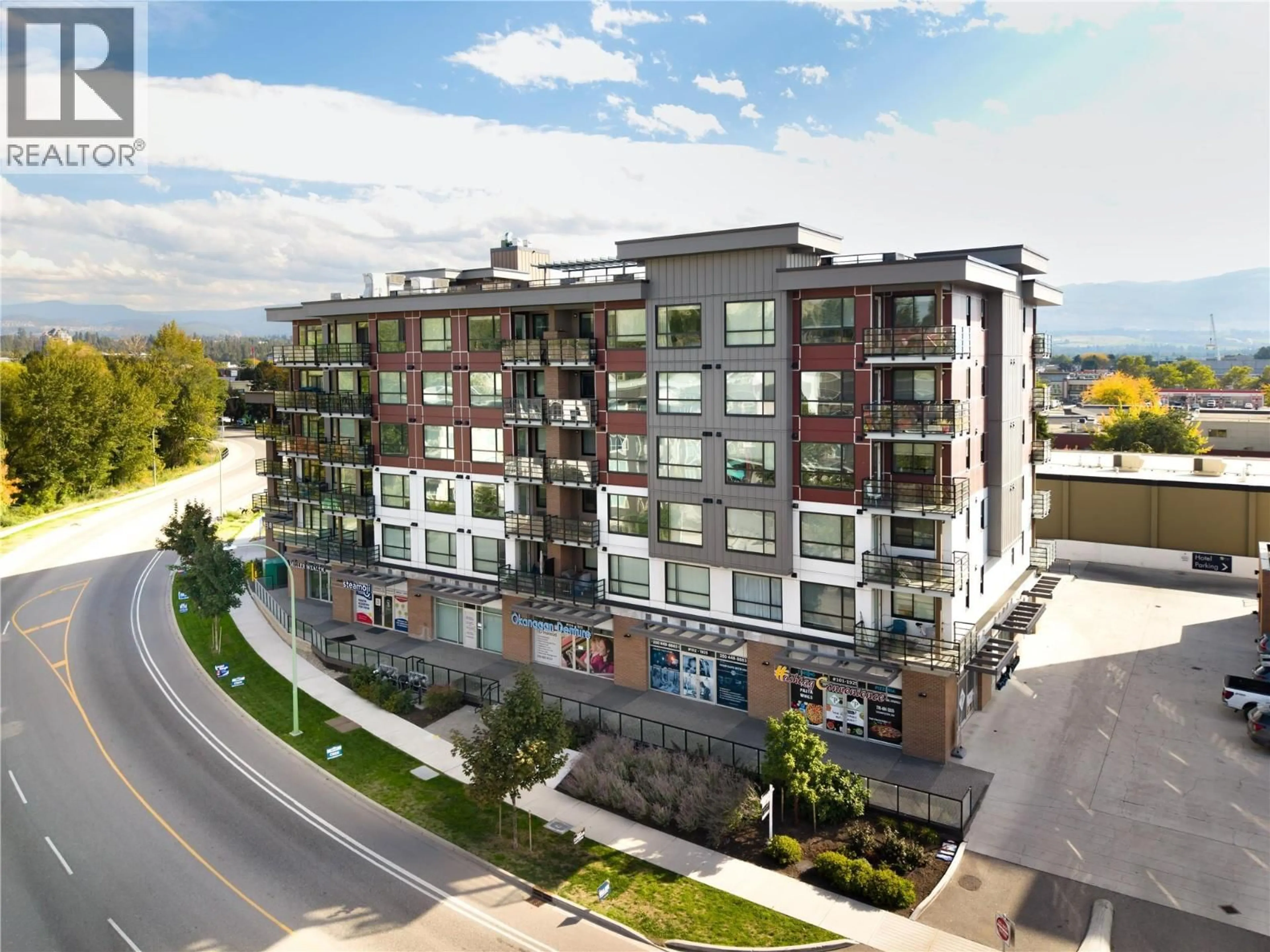 A pic from outside/outdoor area/front of a property/back of a property/a pic from drone, unknown for 406 - 1925 ENTERPRISE WAY, Kelowna British Columbia V1Y0J8