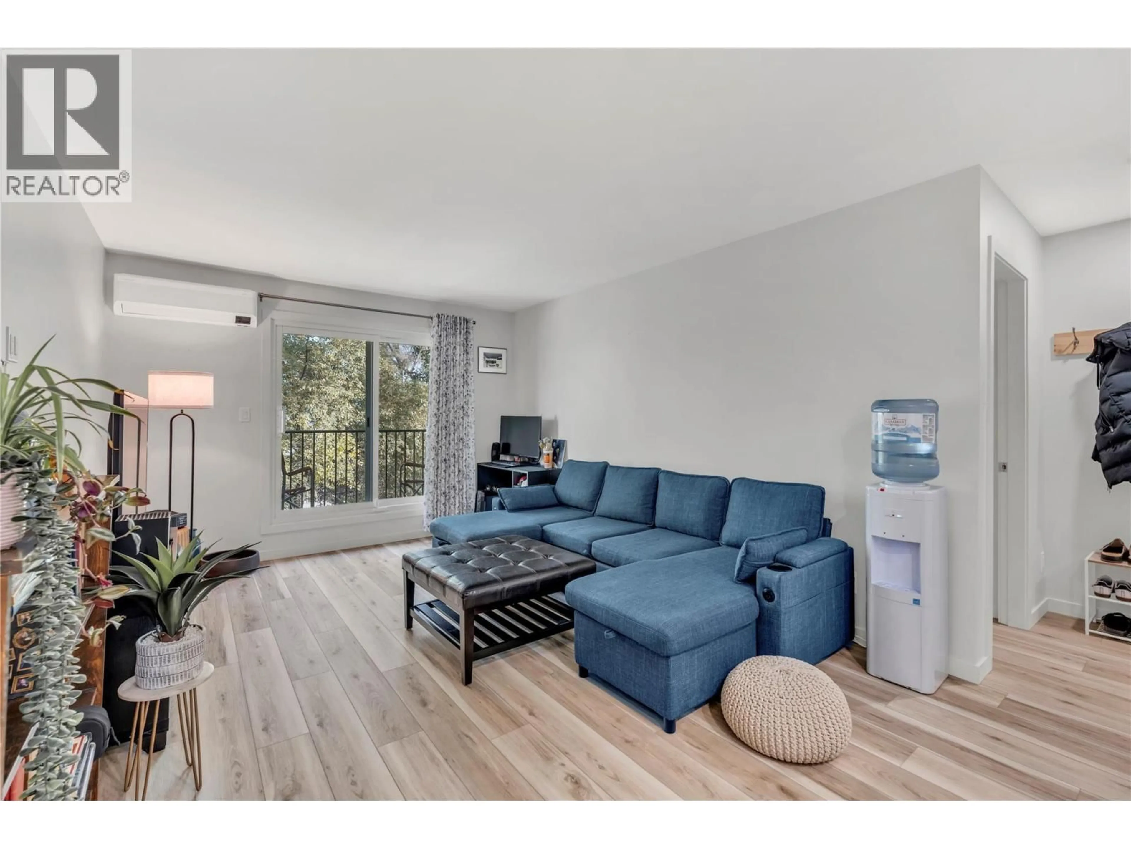 Living room with furniture, wood/laminate floor for 309 - 922 DYNES AVENUE, Penticton British Columbia V2A1E8