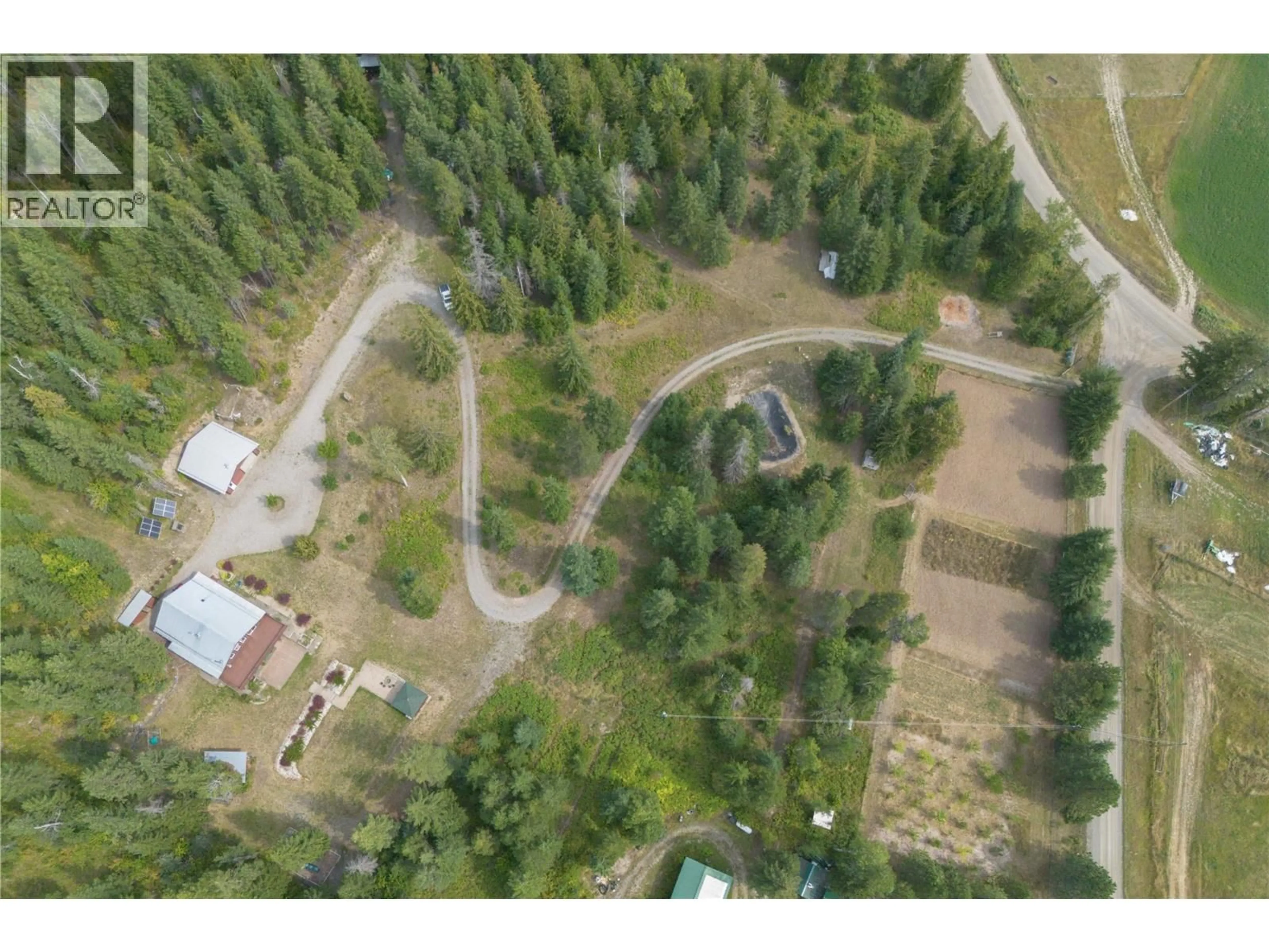 A pic from outside/outdoor area/front of a property/back of a property/a pic from drone, forest/trees view for 27 PINE ROAD, Cherryville British Columbia V0E2G3
