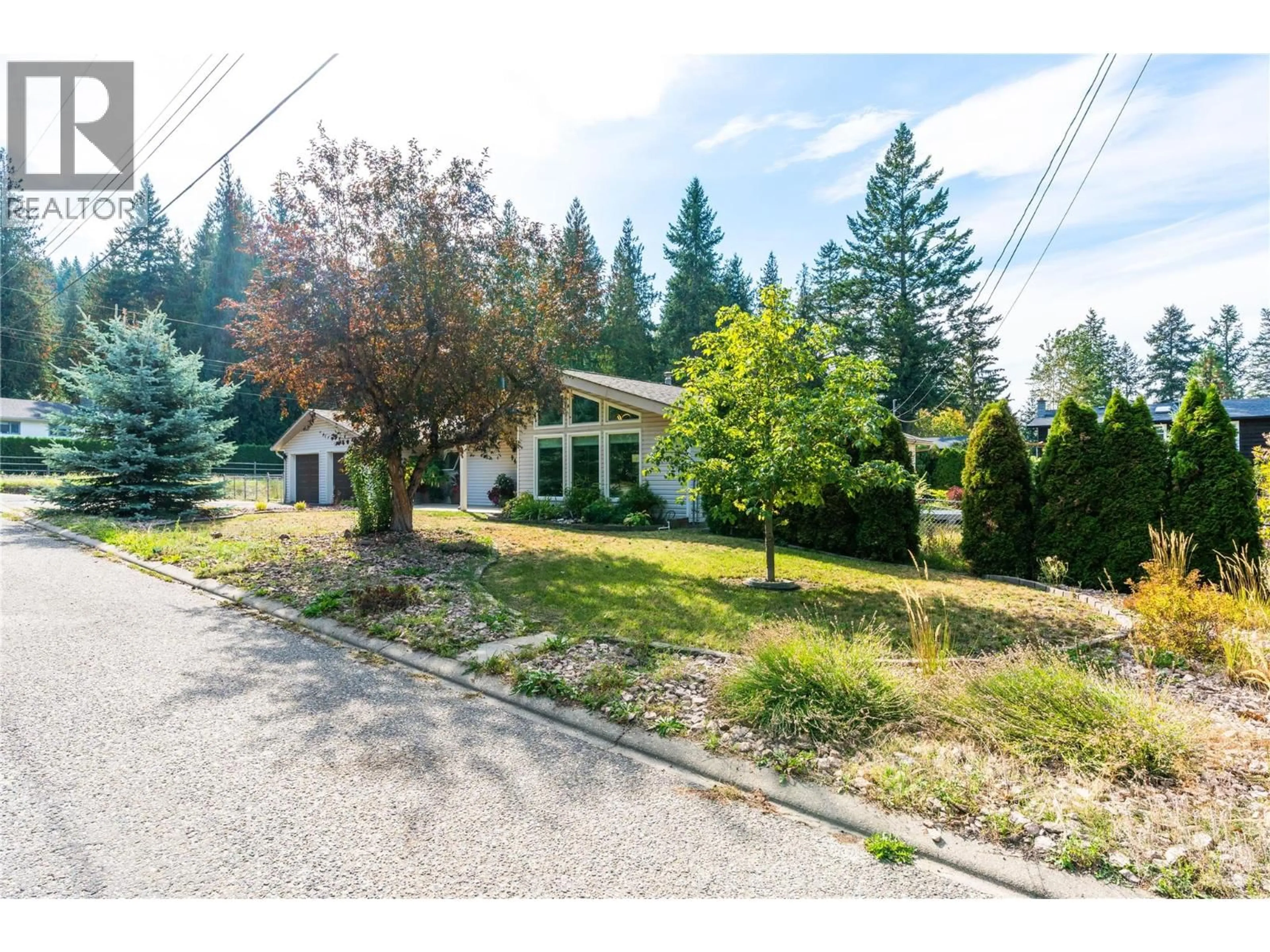 A pic from outside/outdoor area/front of a property/back of a property/a pic from drone, street for 9434 ANGUS DRIVE, Coldstream British Columbia V1B3G1