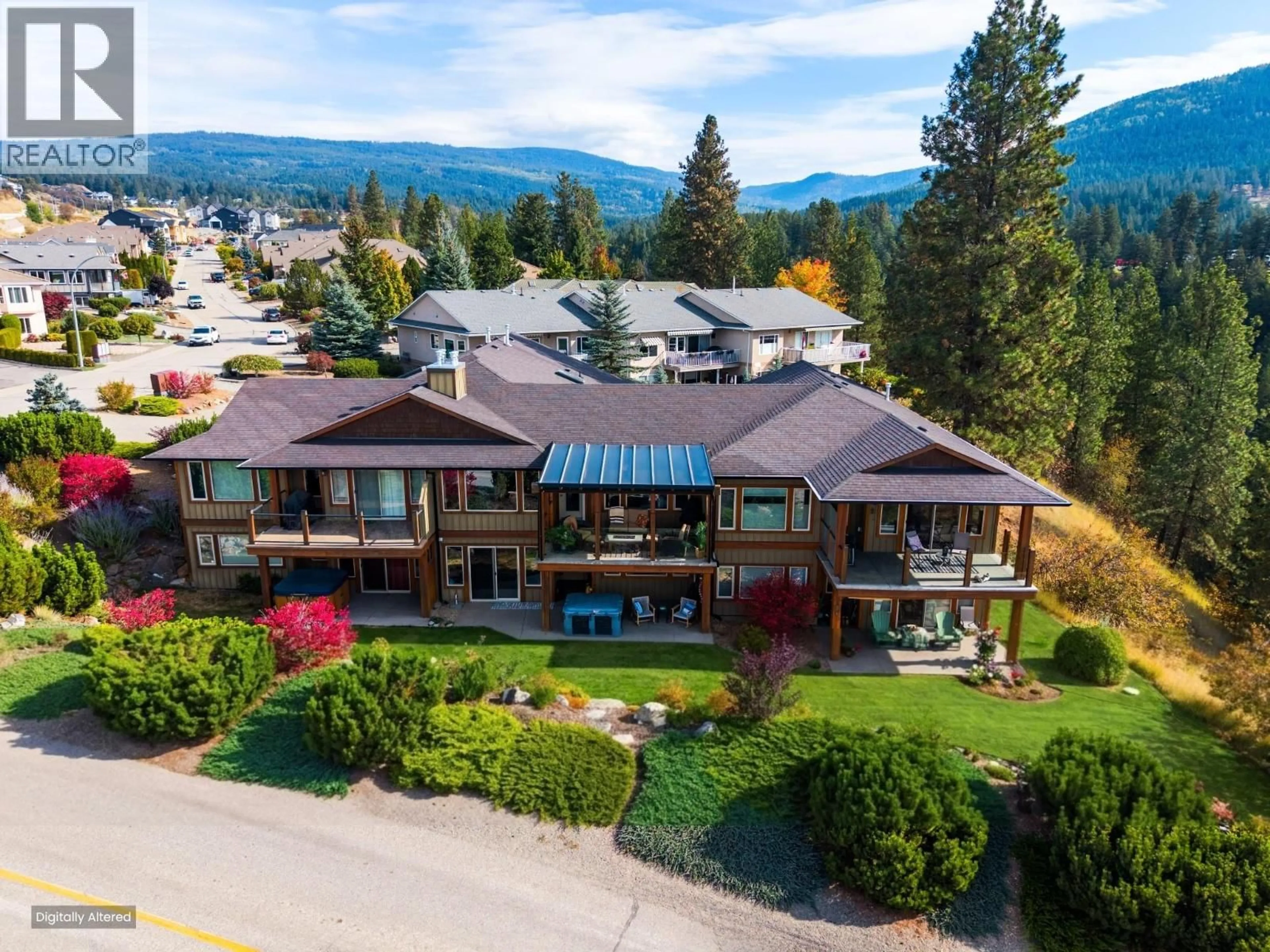 A pic from outside/outdoor area/front of a property/back of a property/a pic from drone, mountain view for 2 - 6900 MANNING PLACE, Vernon British Columbia V1B2Y5
