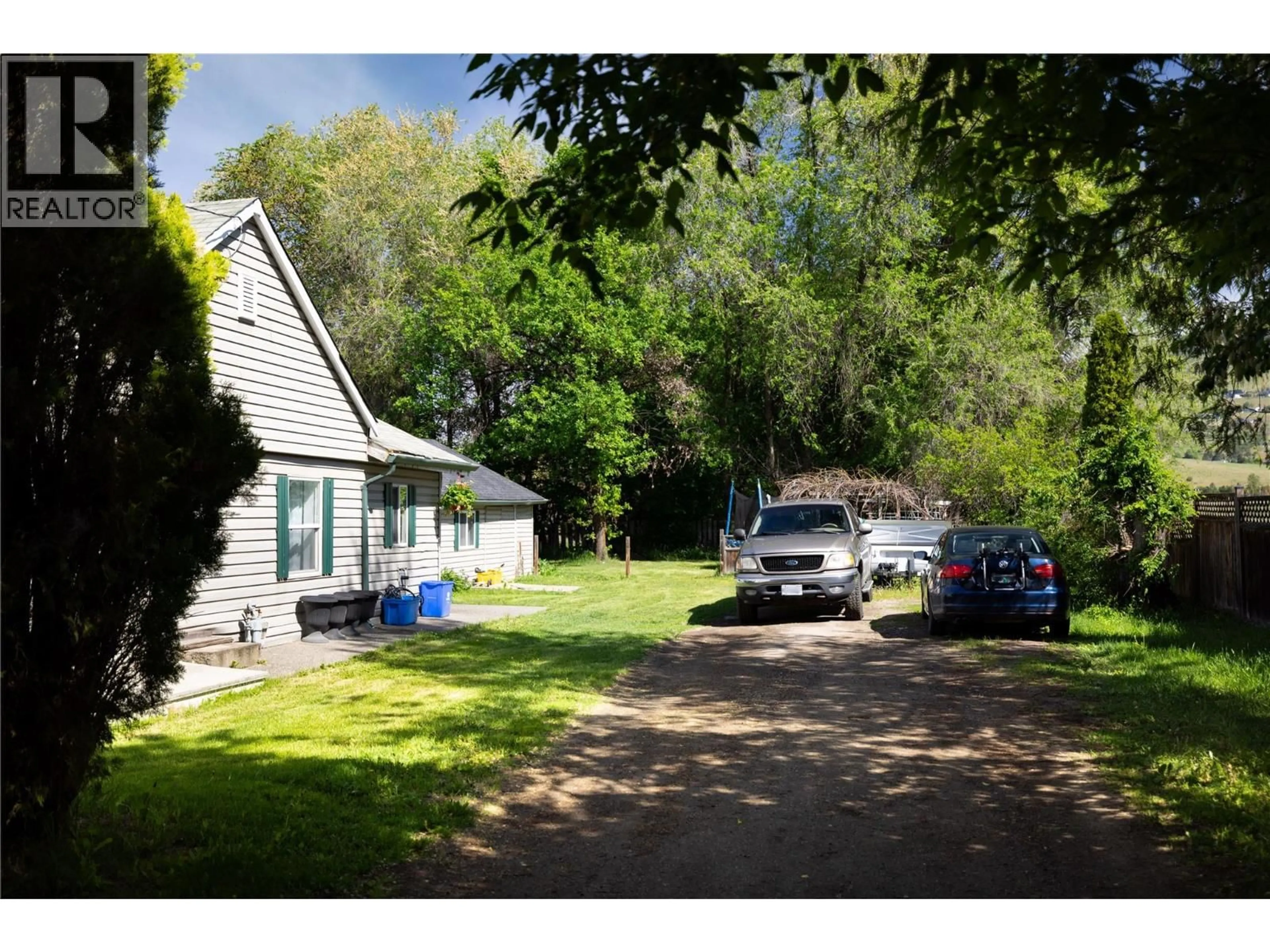 A pic from outside/outdoor area/front of a property/back of a property/a pic from drone, street for 8997 KALAMALKA ROAD, Coldstream British Columbia V1B3C2