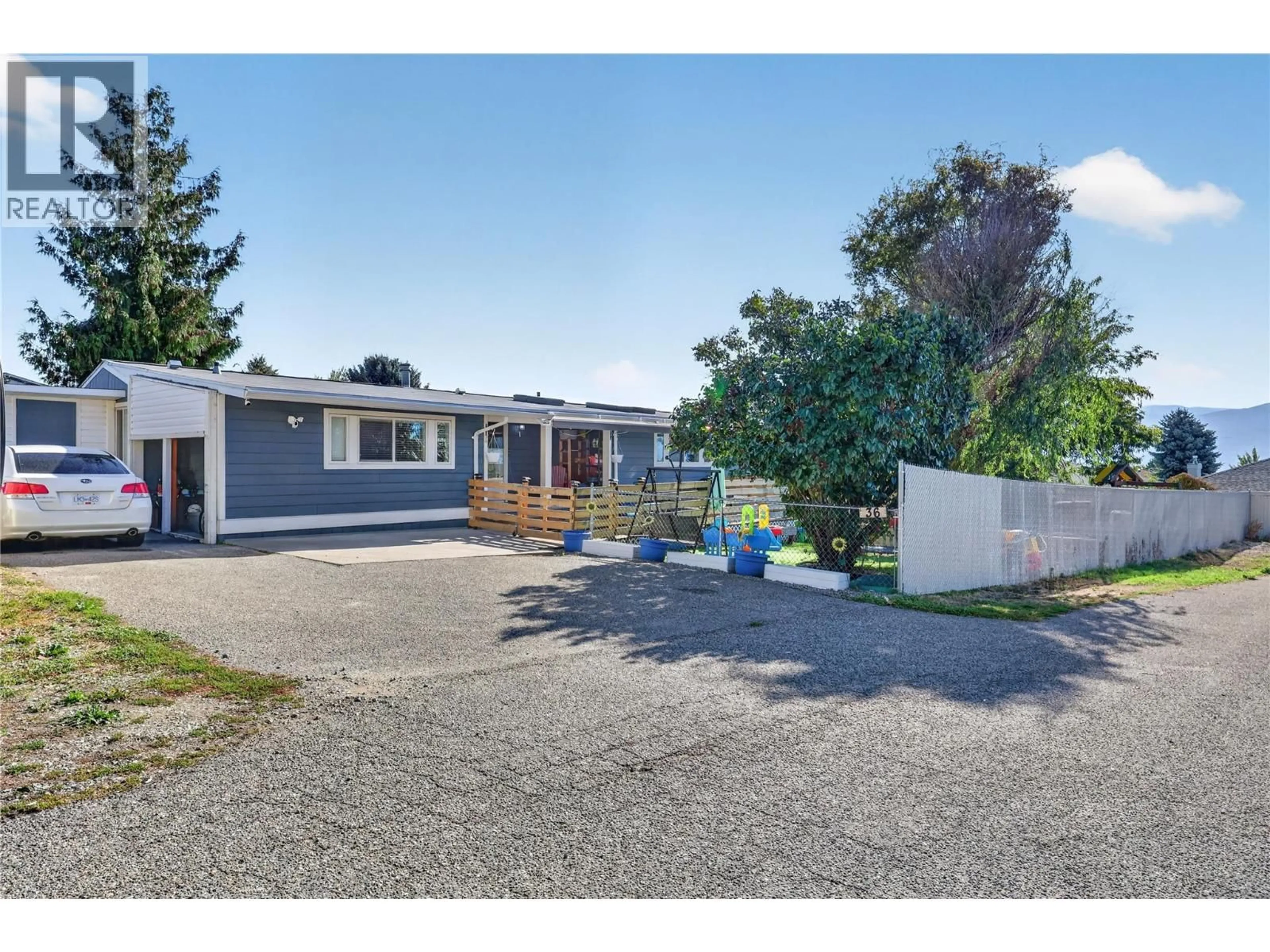 A pic from outside/outdoor area/front of a property/back of a property/a pic from drone, street for 36 - 3381 VILLAGE GREEN WAY, West Kelowna British Columbia V4T1L2