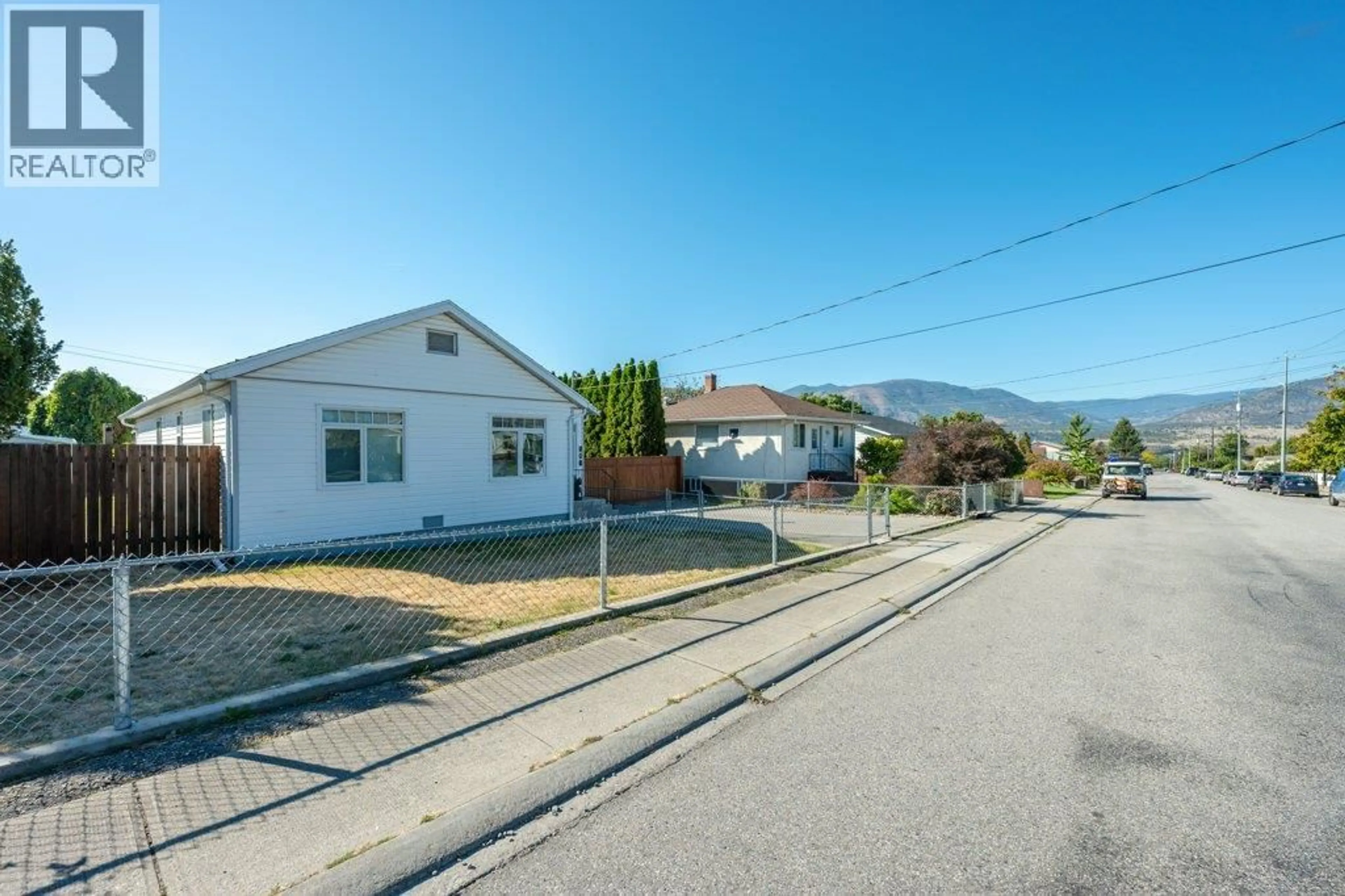 A pic from outside/outdoor area/front of a property/back of a property/a pic from drone, street for 584 EDNA AVENUE, Penticton British Columbia V2A2M2