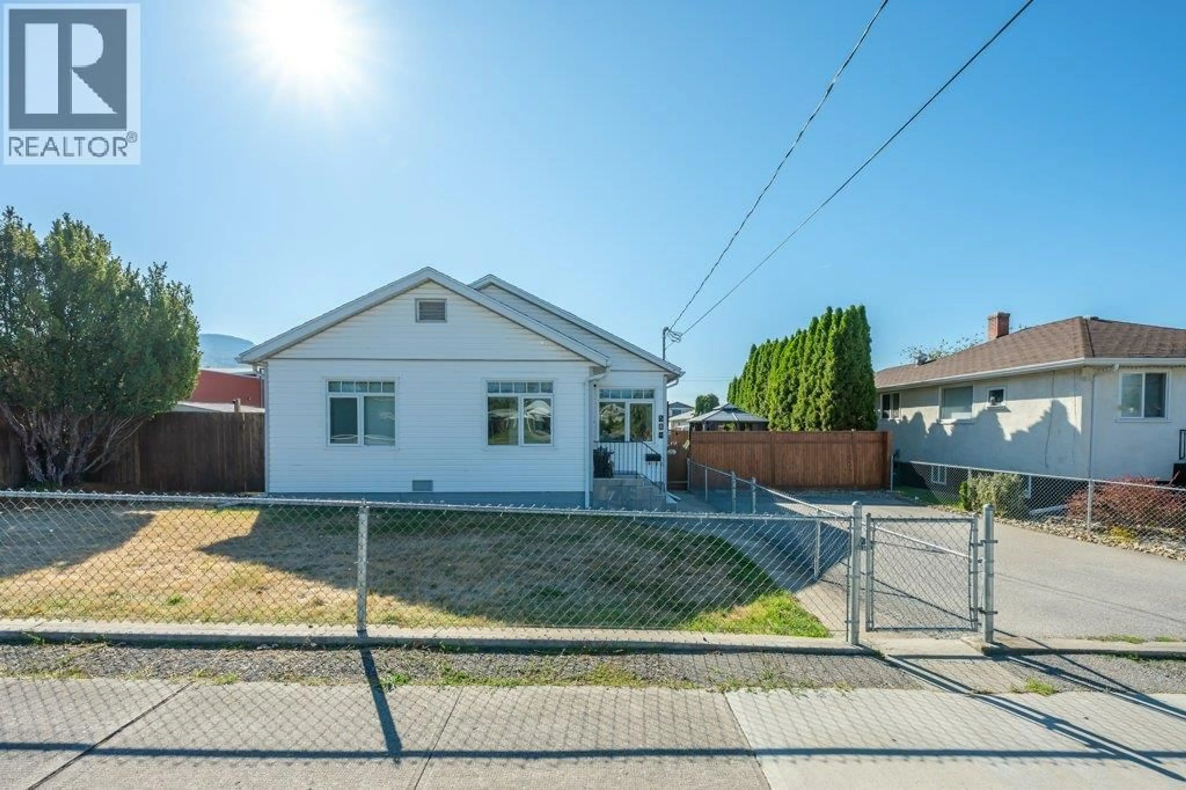 A pic from outside/outdoor area/front of a property/back of a property/a pic from drone, street for 584 EDNA AVENUE, Penticton British Columbia V2A2M2