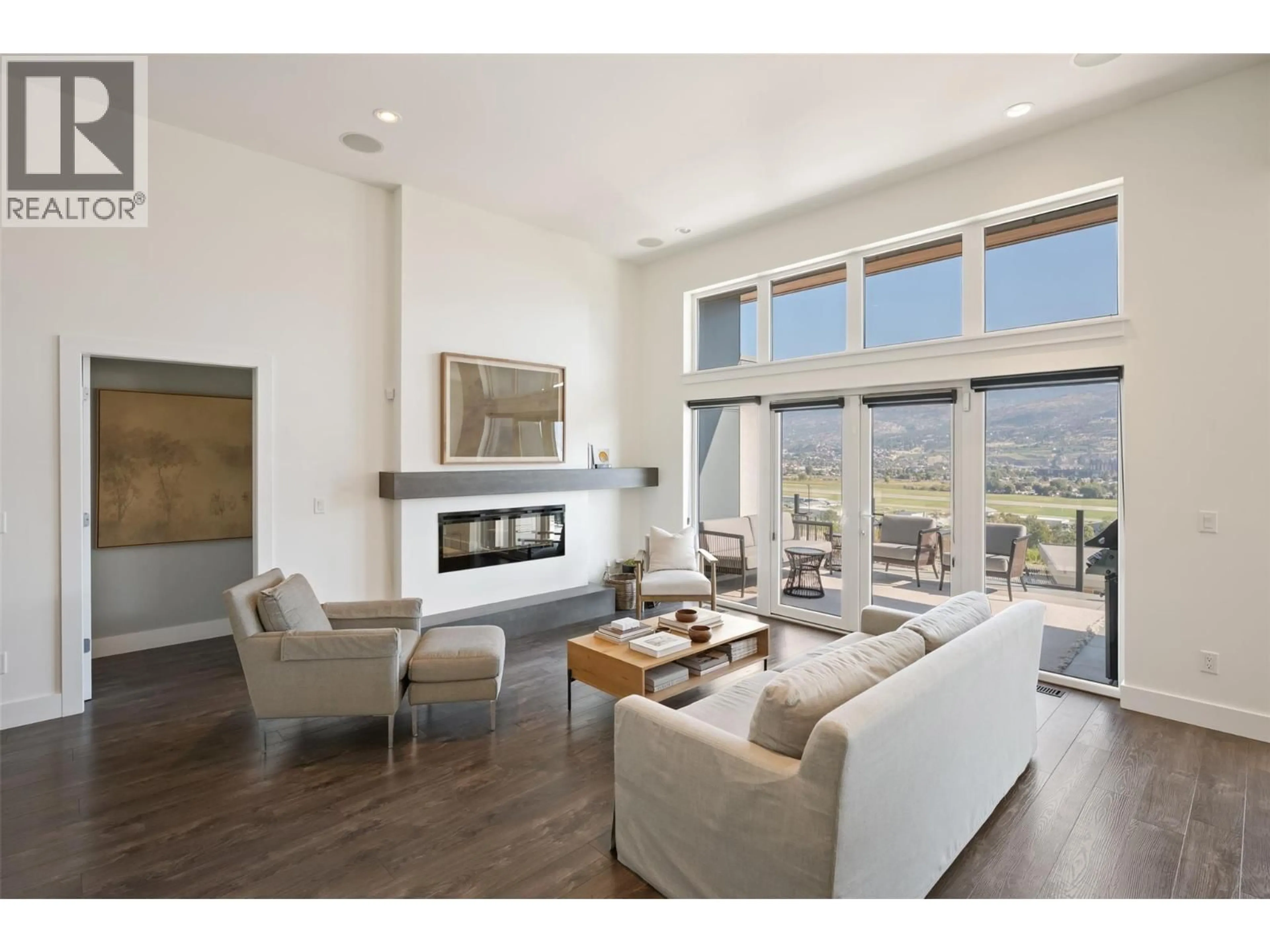 Living room with furniture, wood/laminate floor for 104 VIEW WAY, Penticton British Columbia V2A0A6